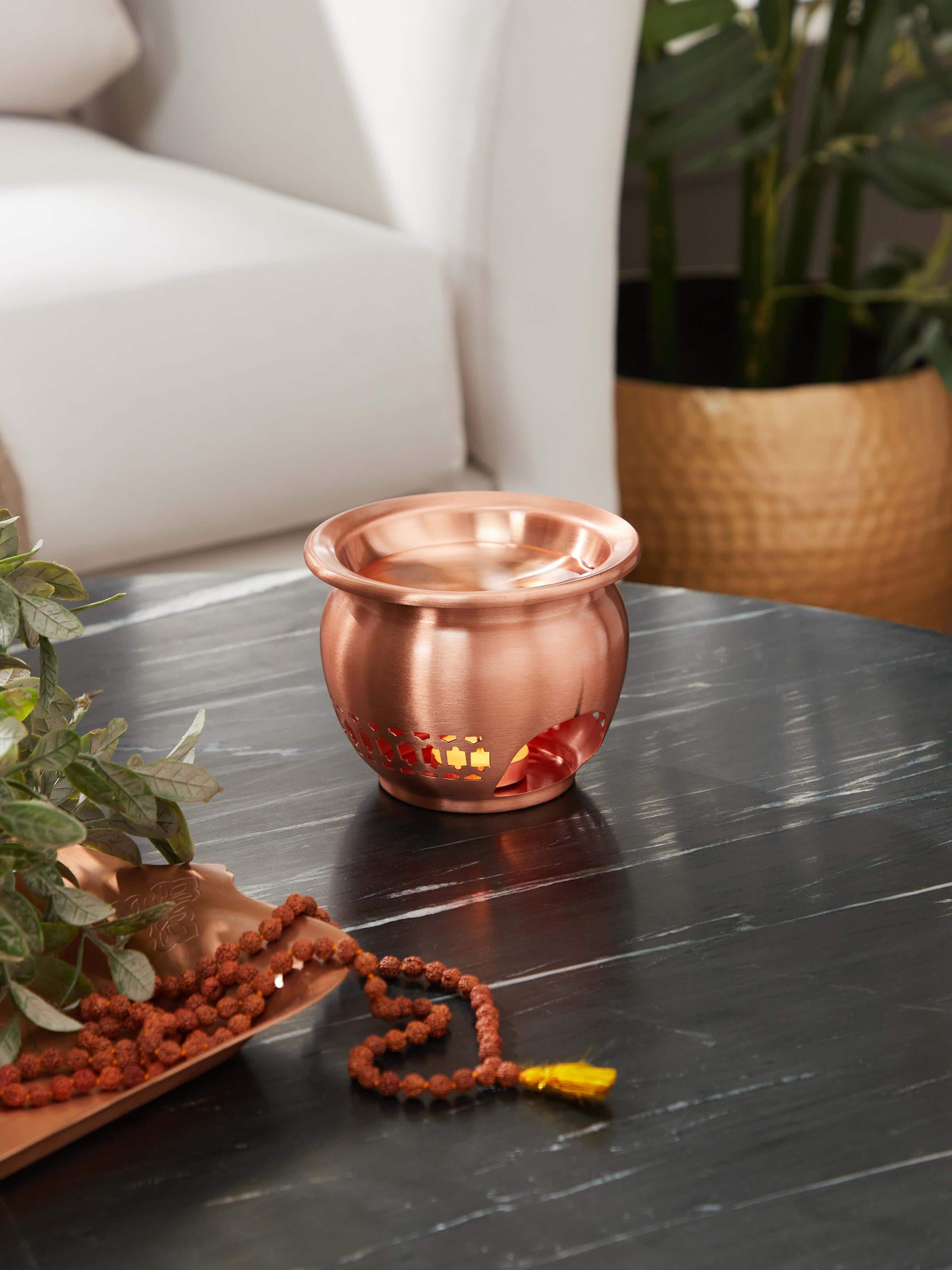 Side view of natural copper diffuser highlighting smooth contours and elegant style