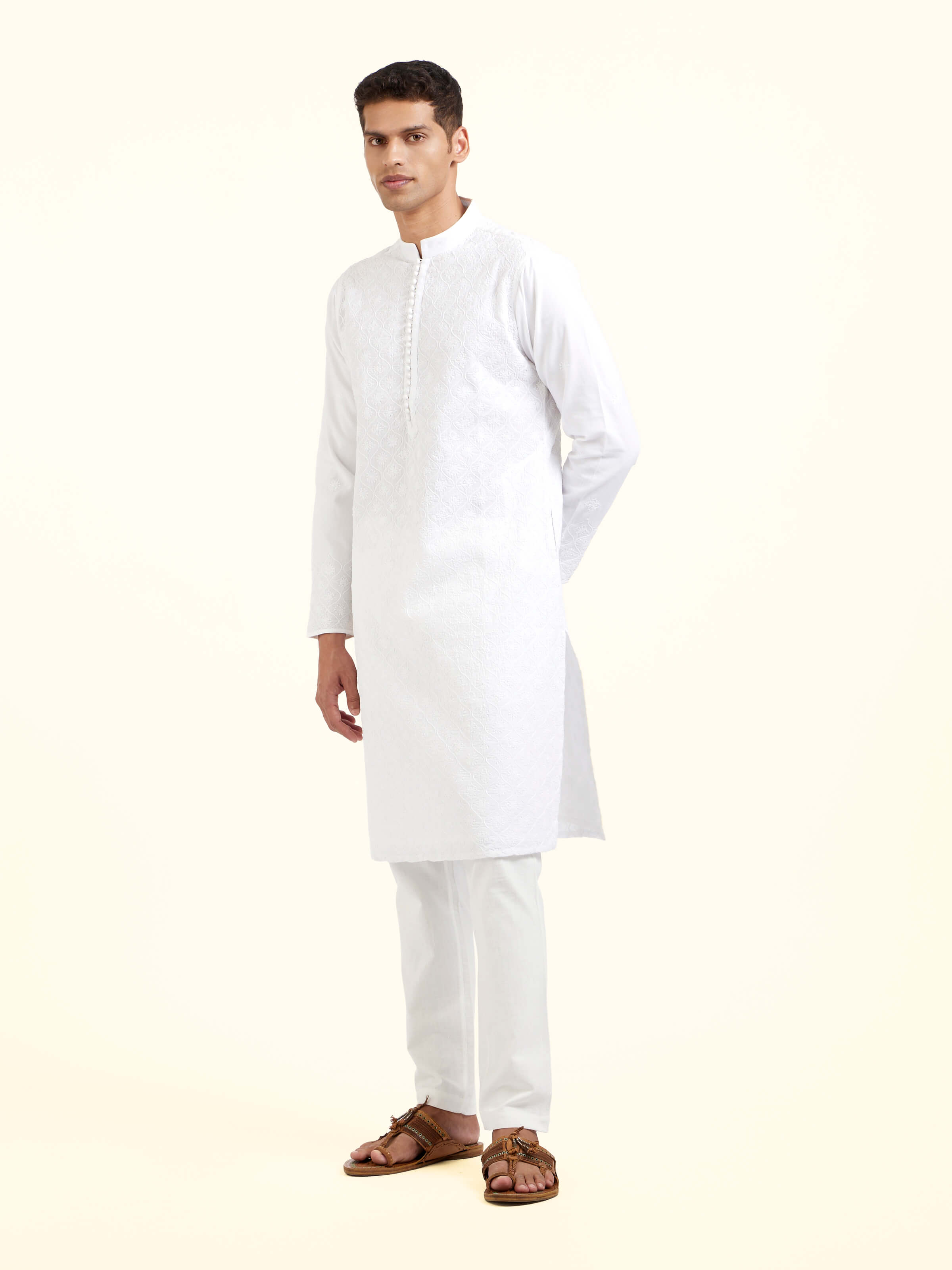 Side view of white cotton chikankari long kurta showcasing relaxed silhouette