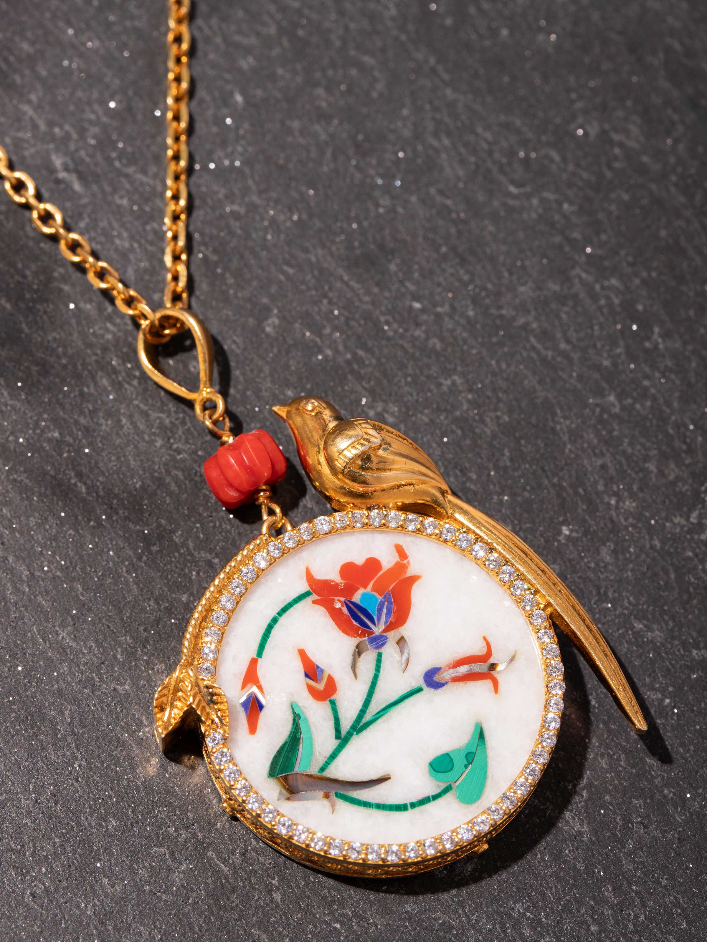 Detail shot of Parchinkari pendant showing close-up of inlay work and ornamental finish.