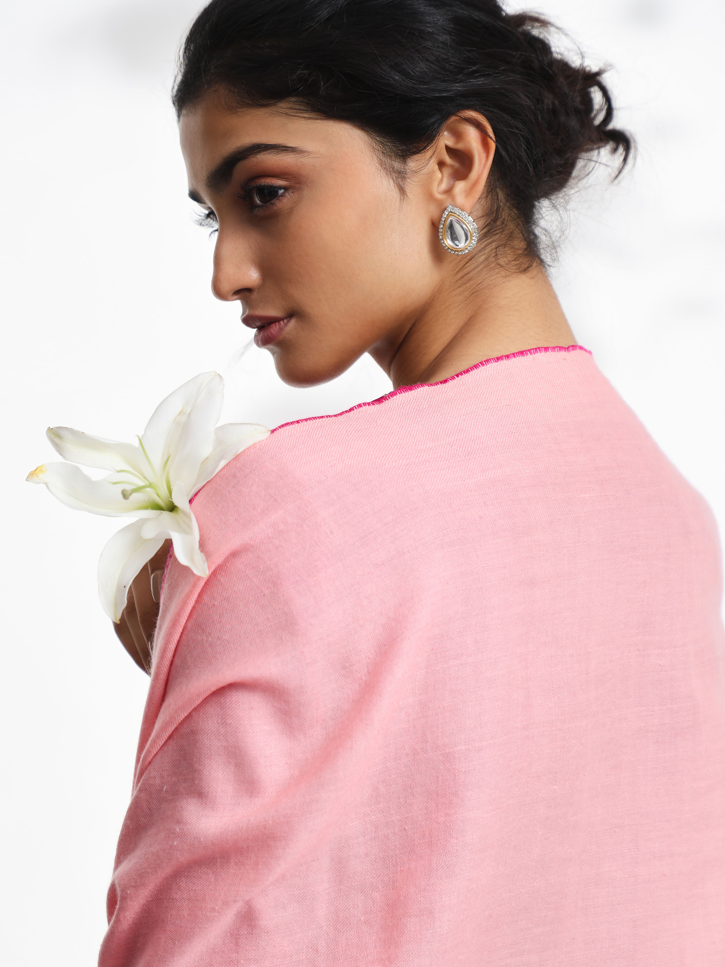 Detail view of pink cashmere kaaj embroidered handwoven stole showcasing fine craftsmanship