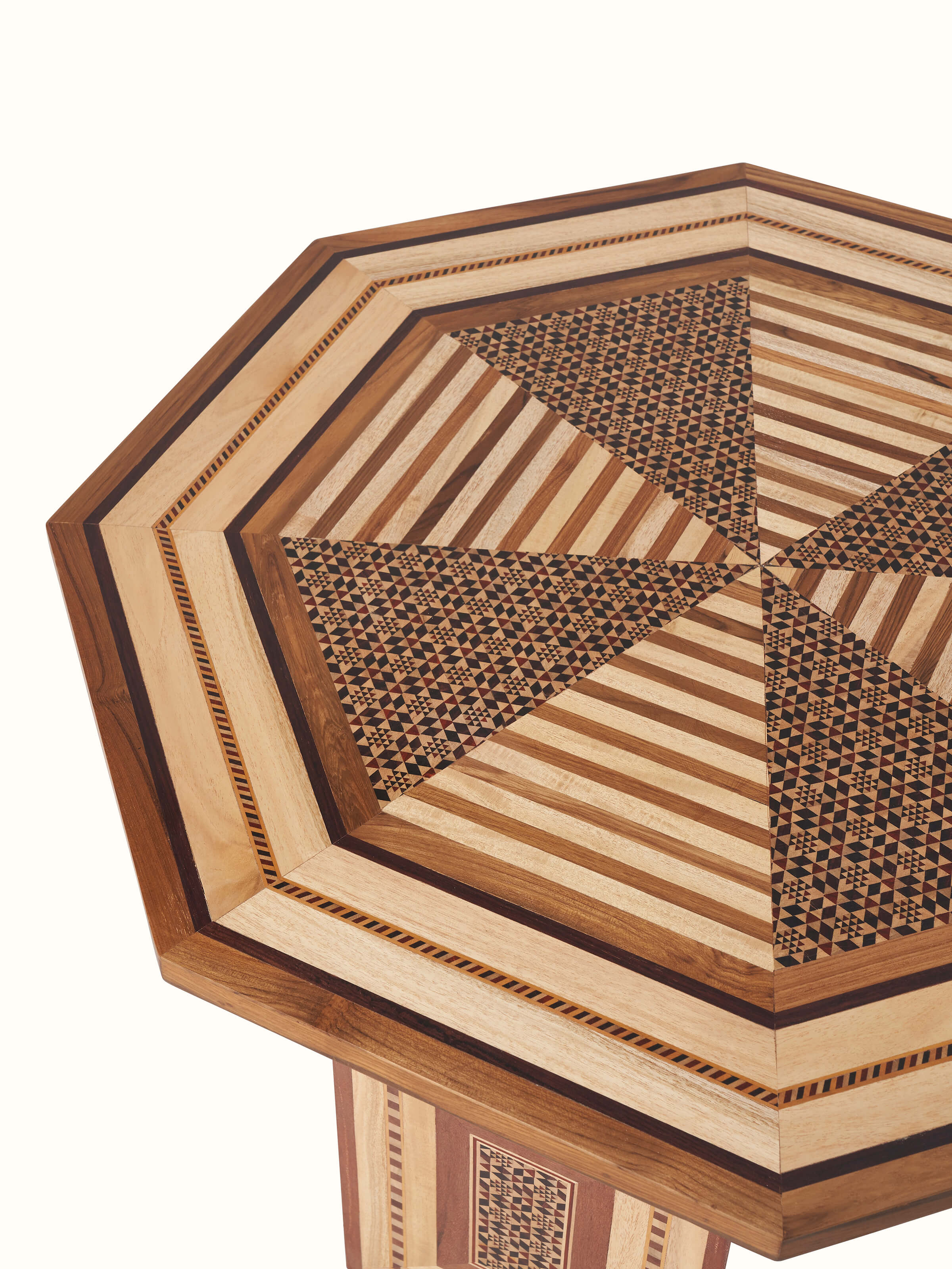 Close-up of the marquetry details on Teak Coffee Table, showing the craftsmanship and patterns
