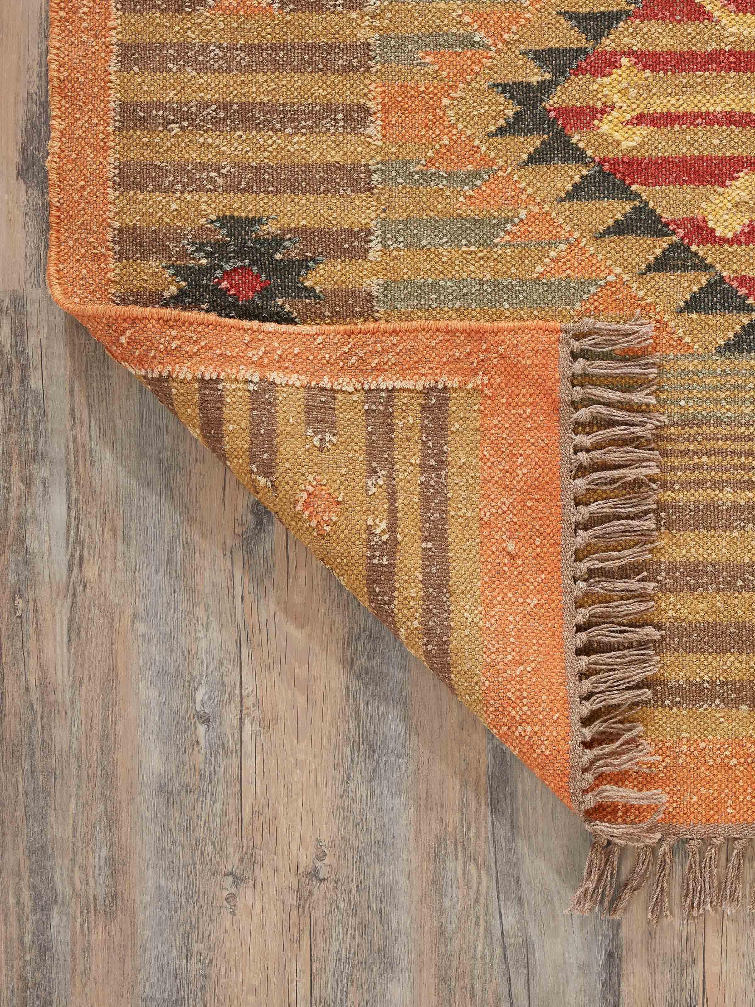 Detailed view of Traditional Kilim rust Lawan jute and wool Panja dhurrie emphasizing the craftsmanship and pattern intricacies