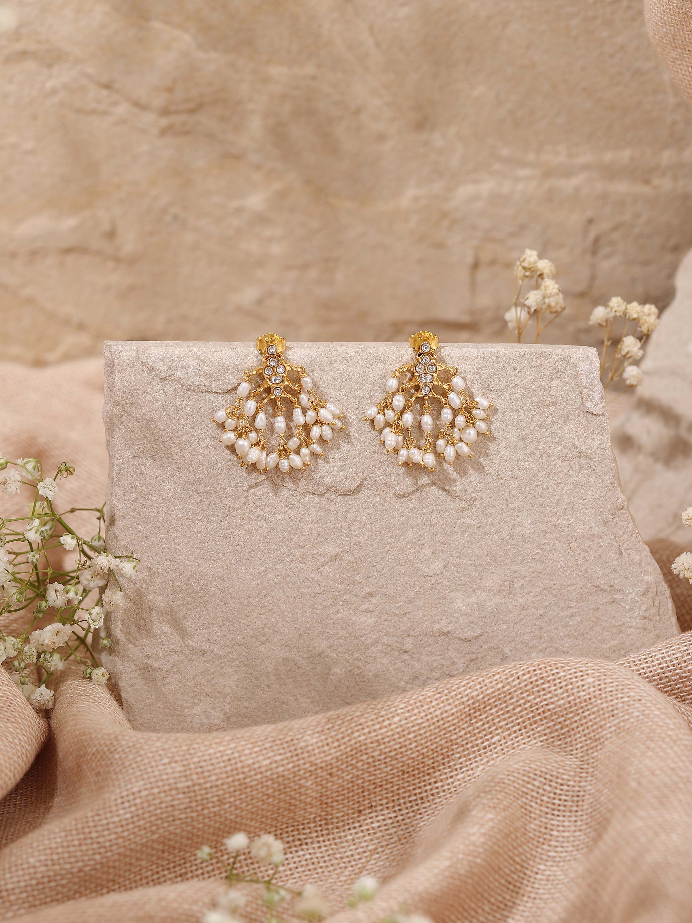 Lifestyle view of Guttapusalu Silver Drop Earrings styled with saree for festive wear.