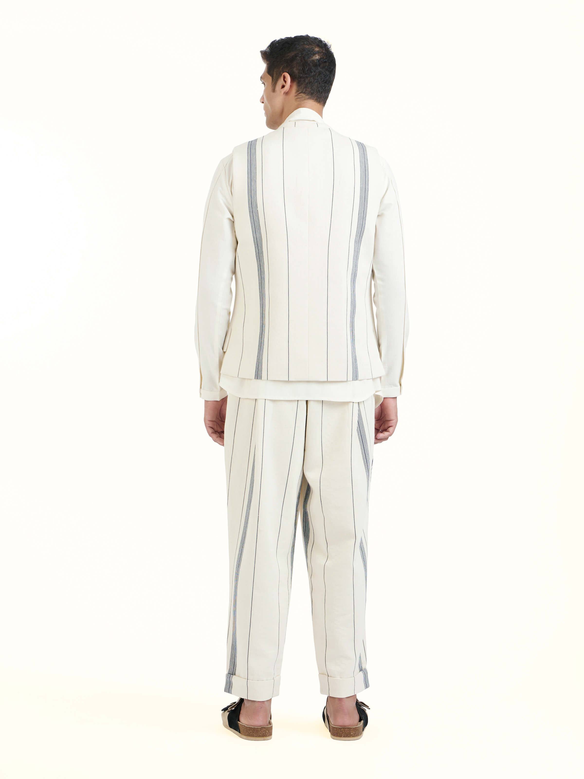 Back view of ivory cotton handloom sleeveless jacket displaying full design