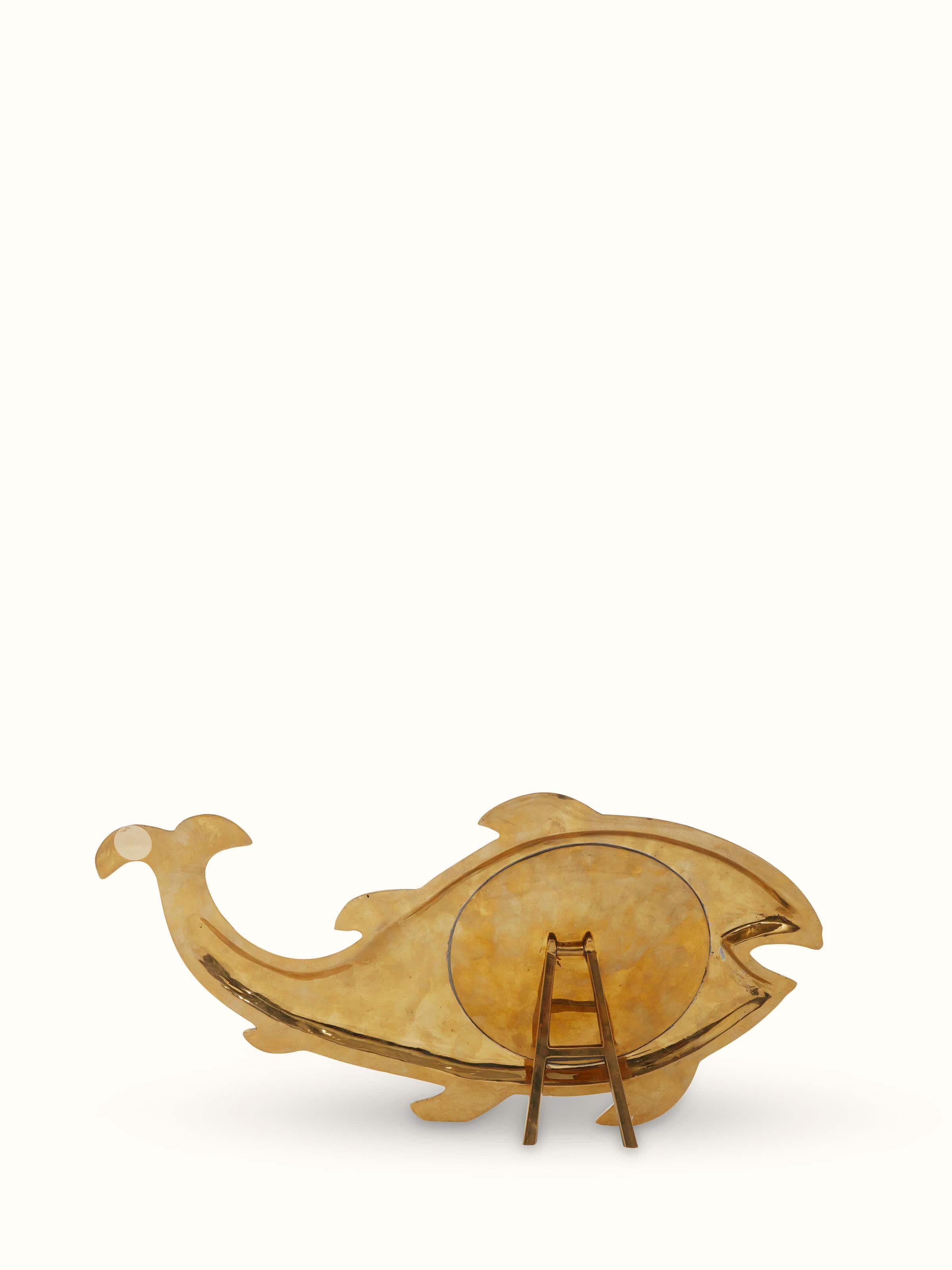 Detailed view of Aranmula kannadi brass mirror showcasing its high polish and traditional style.