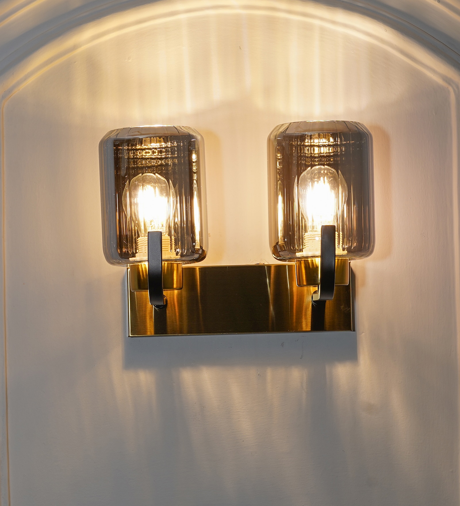 Isabella 2 Light Wall Fitting In Black And Brass Finish Metal With Smoke Glass