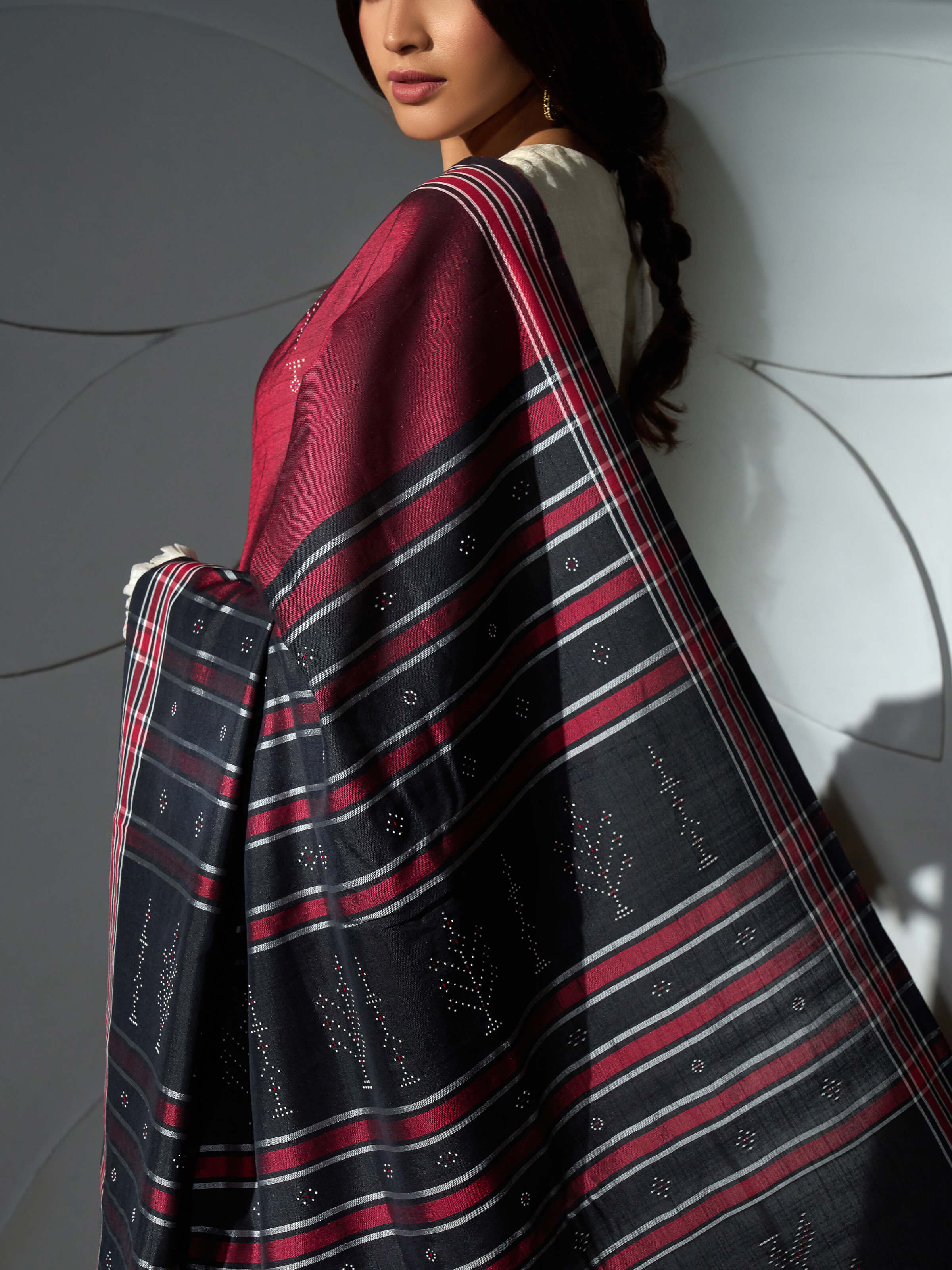 Detail view of maroon cotton silk tangalia saree showing fabric texture and dotted motifs