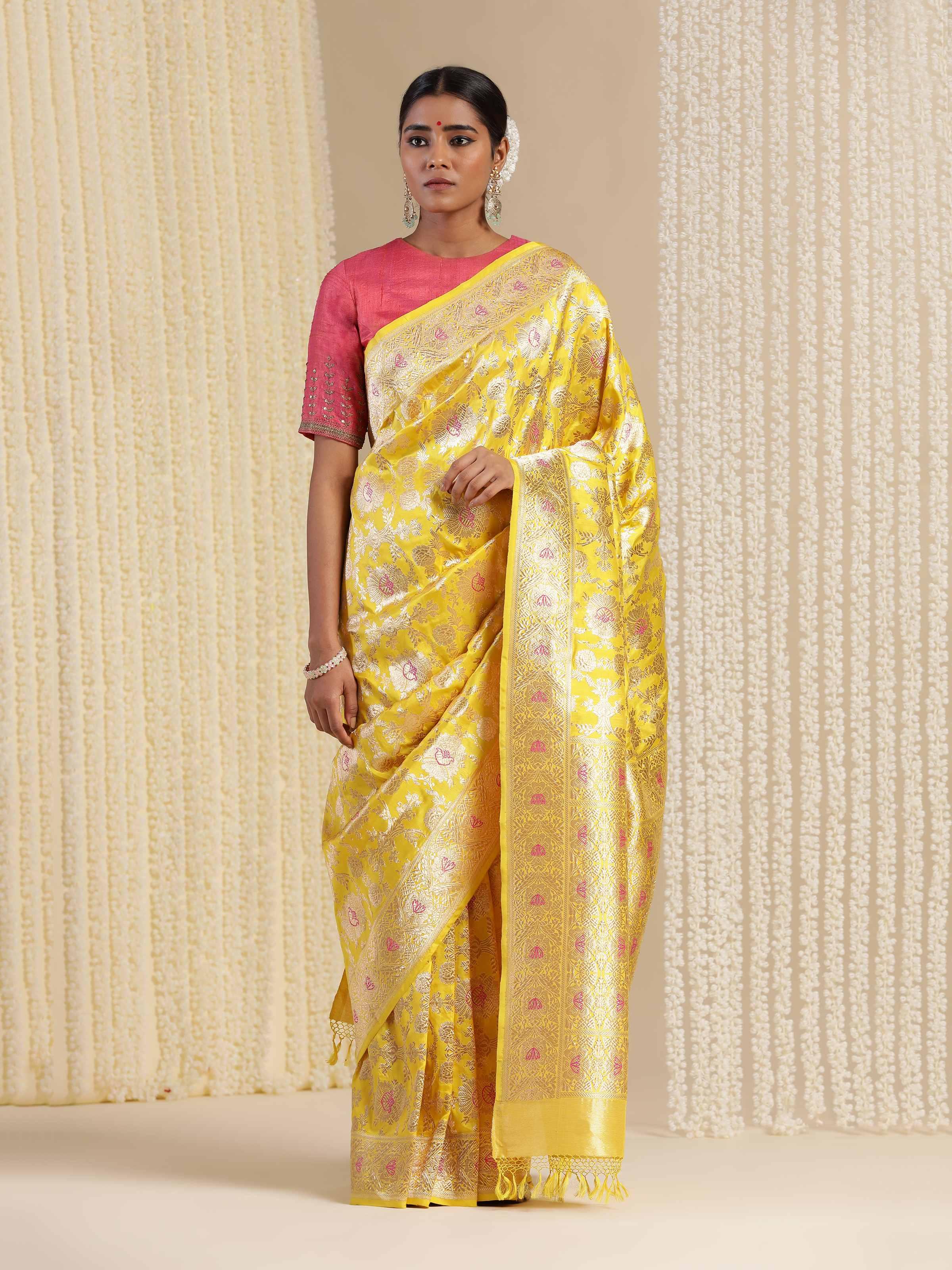 Lifestyle view of yellow mulberry Katan silk Banarasi saree draped elegantly