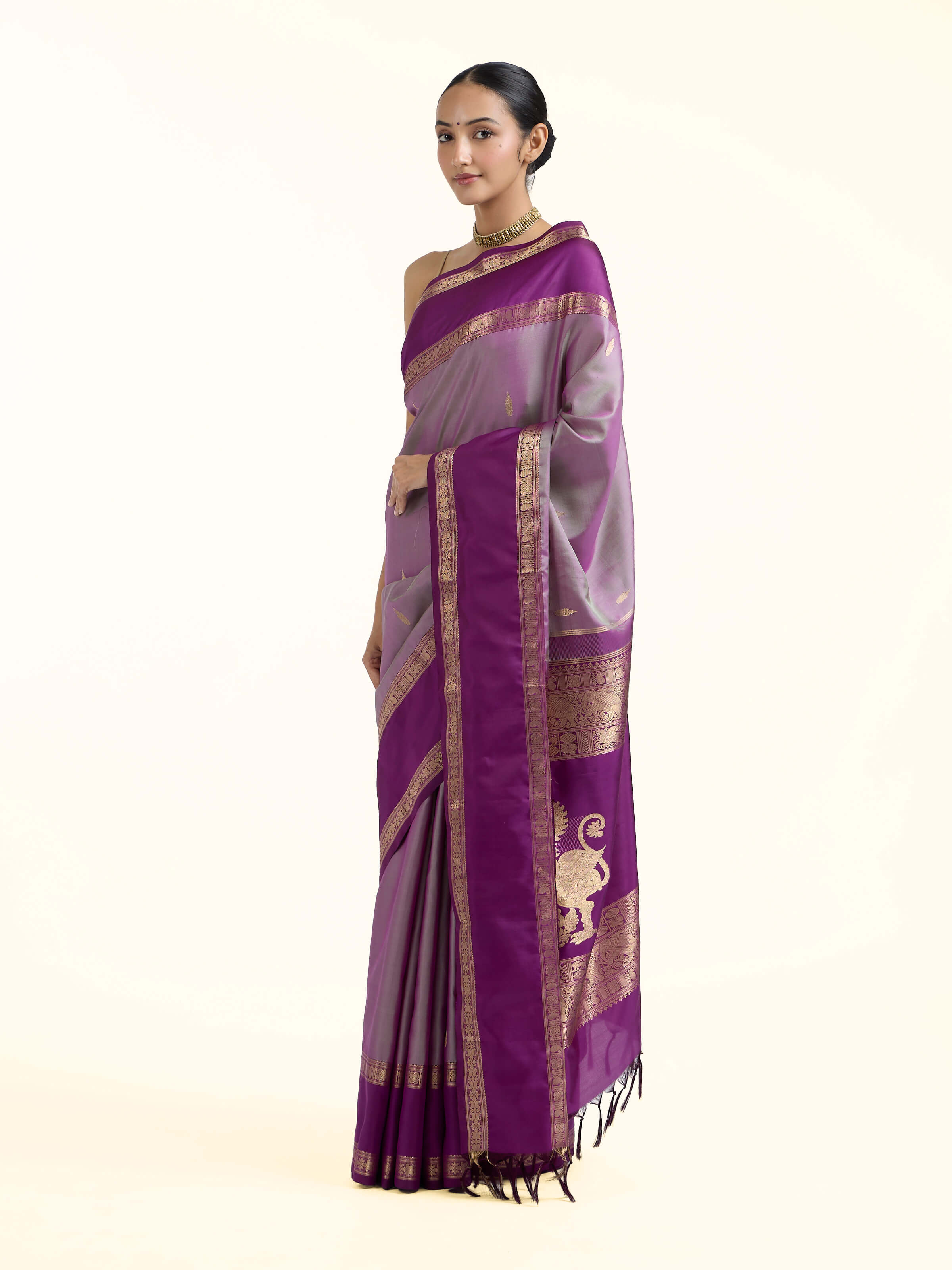 Side view of purple silk Kancheepuram saree with graceful drape