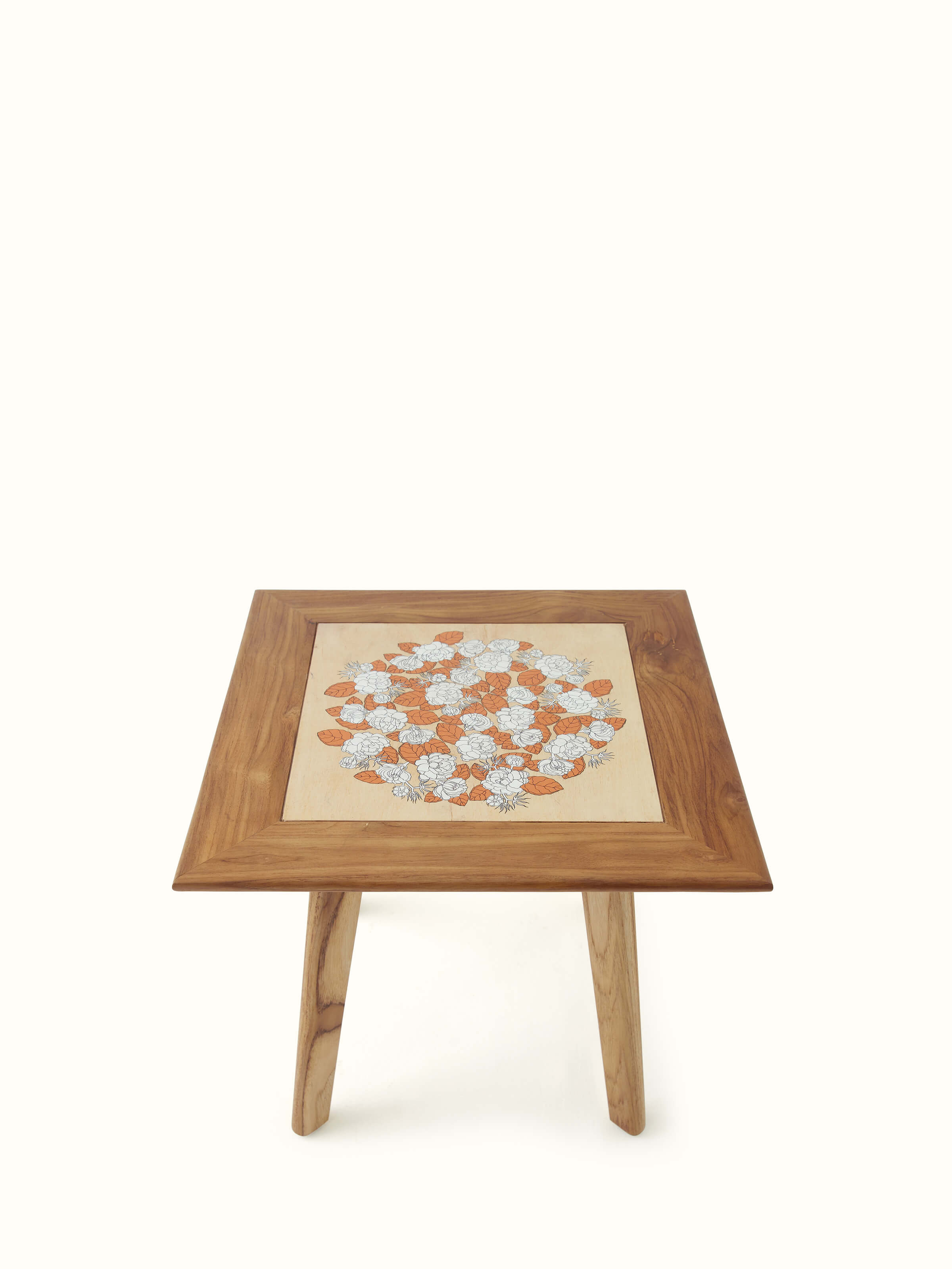Angled view of Teak wood pattachitra square side table, emphasizing the vibrant colors and craftsmanship