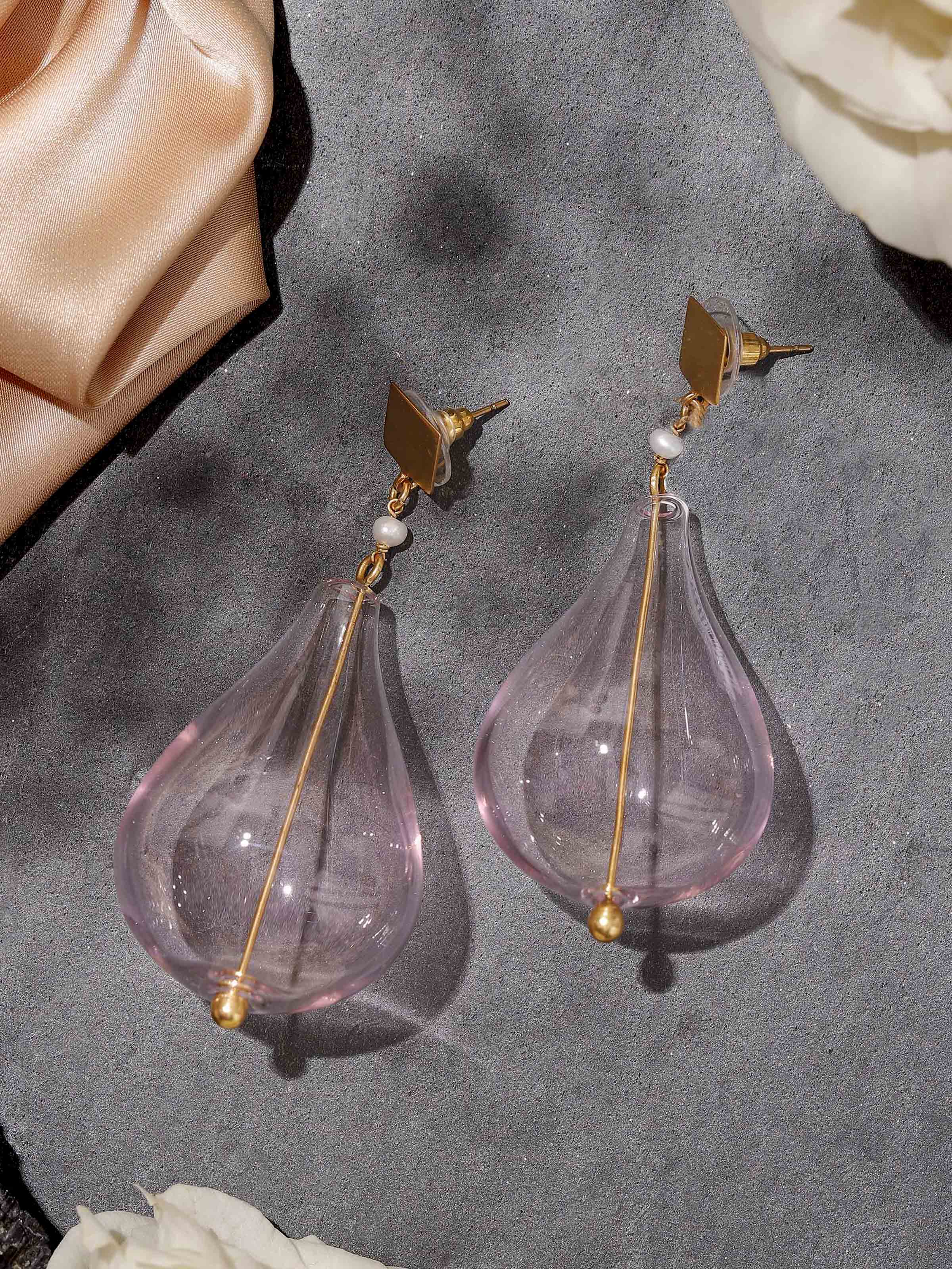 Lifestyle view of silver flame glass drop earrings