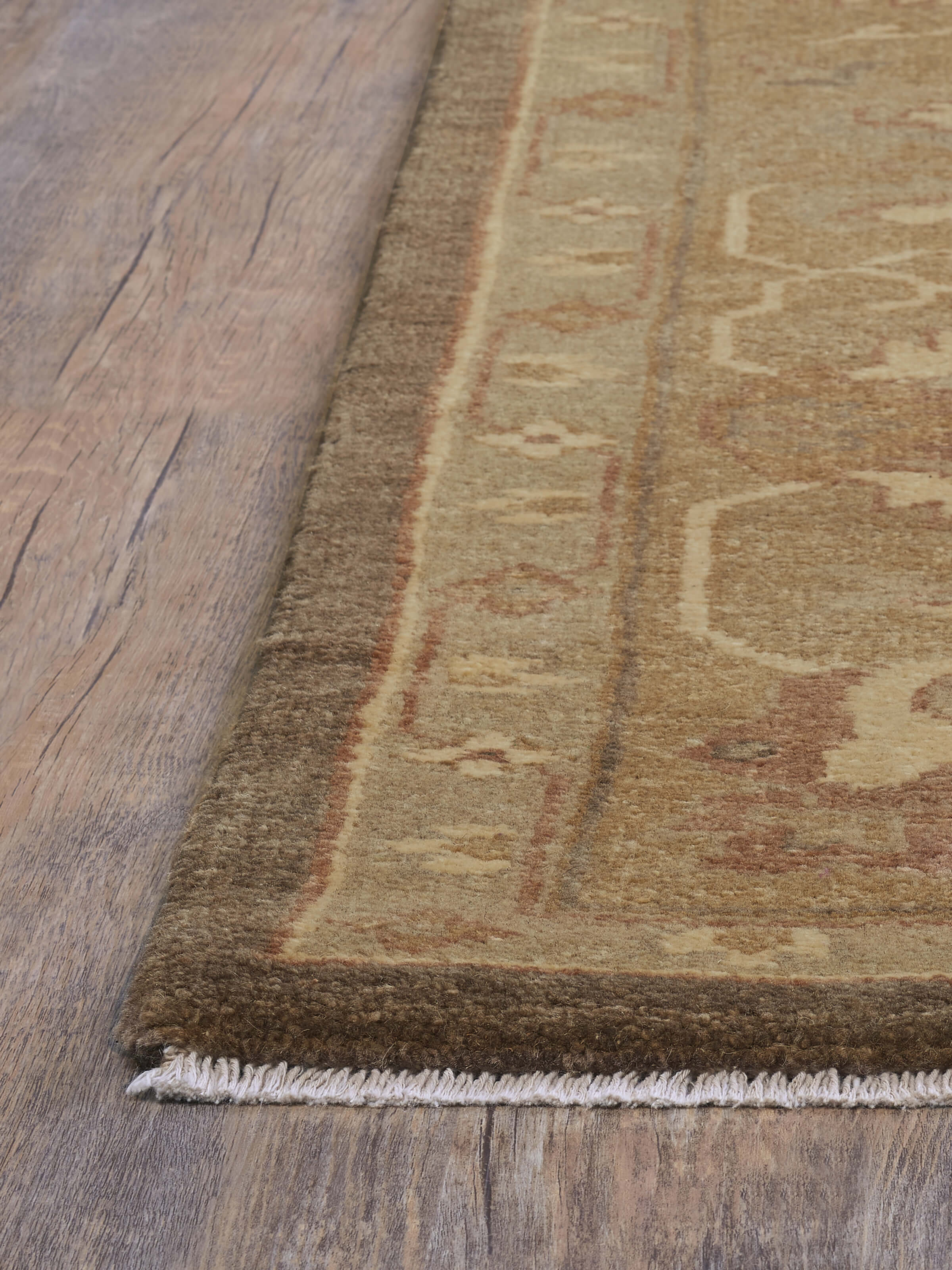 Angled perspective emphasizing the rug’s rich texture and detailed pattern