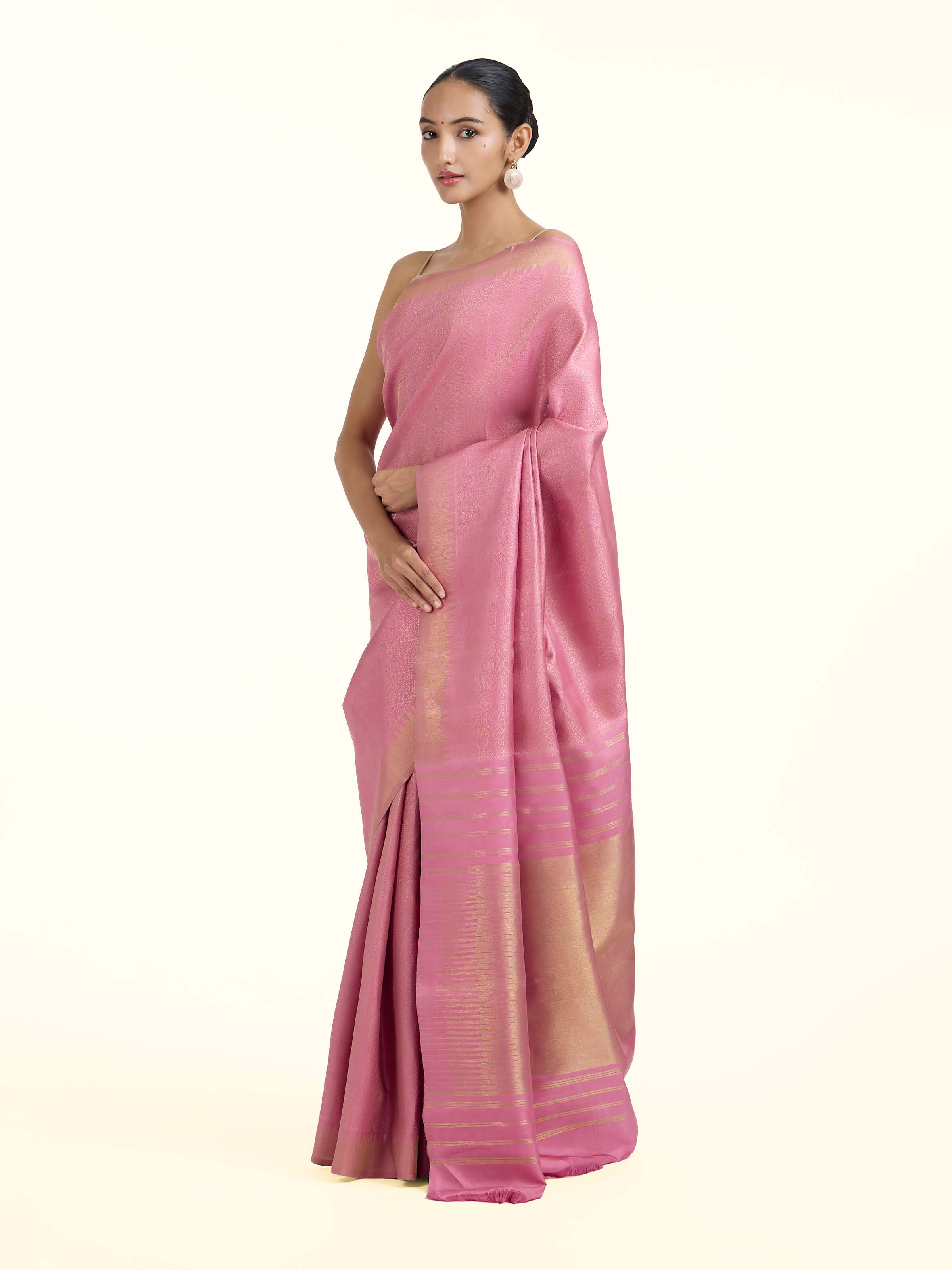 Side view of light pink silk Kancheepuram saree showcasing elegant drape