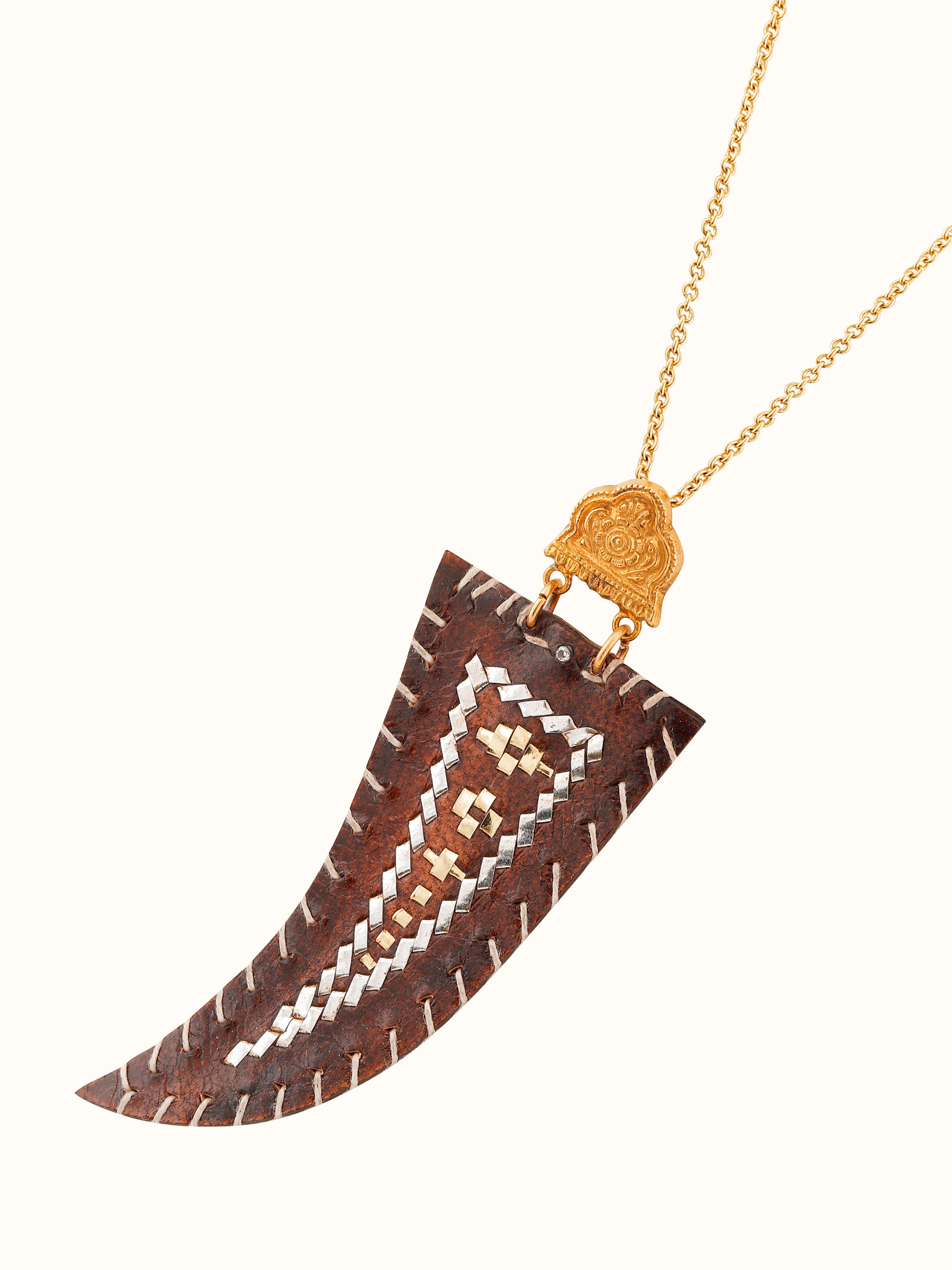 Overhead view displaying pendant’s full design with chain and motif layout