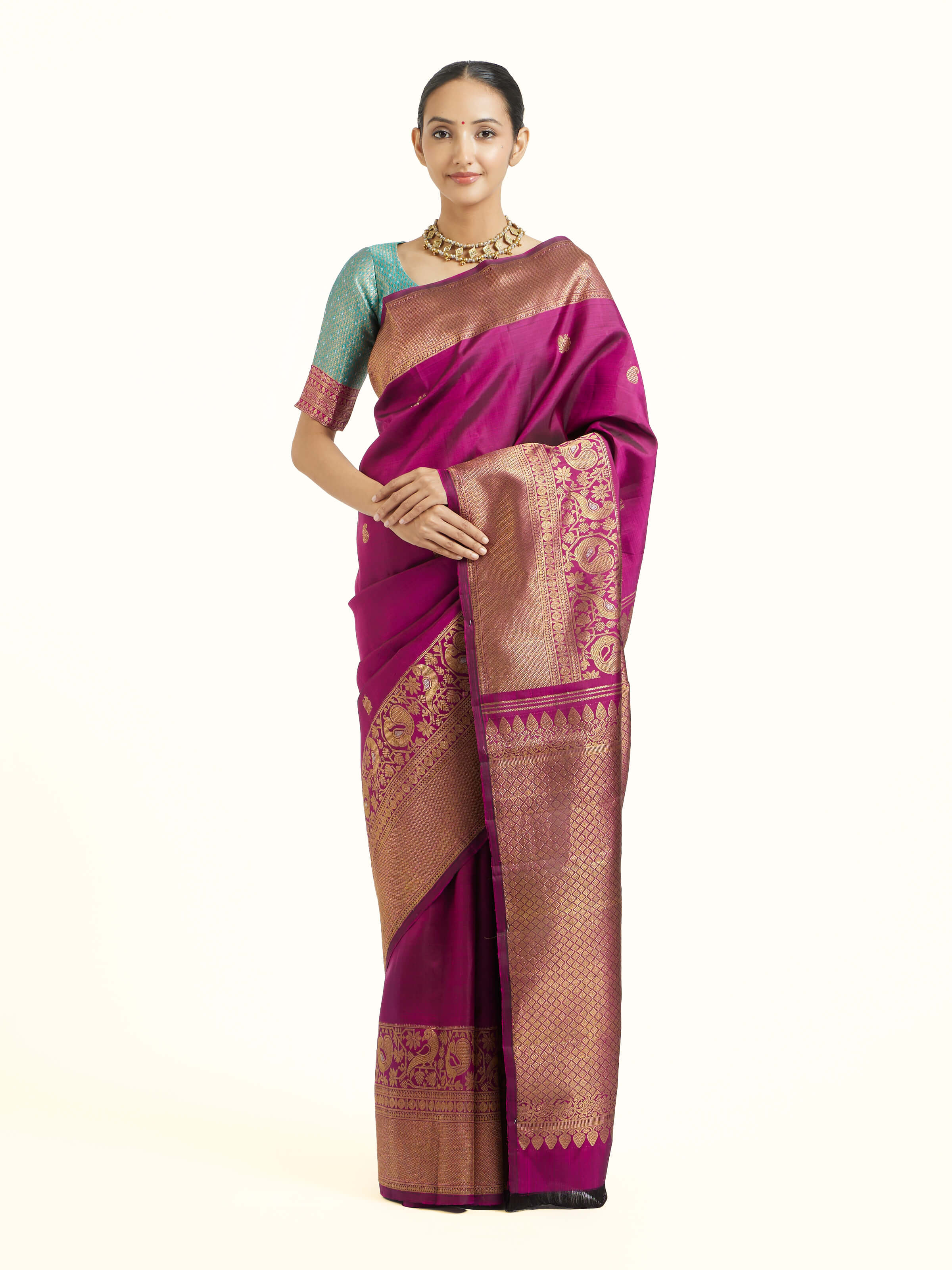 Front view of purple silk Kancheepuram saree with rich zari motifs