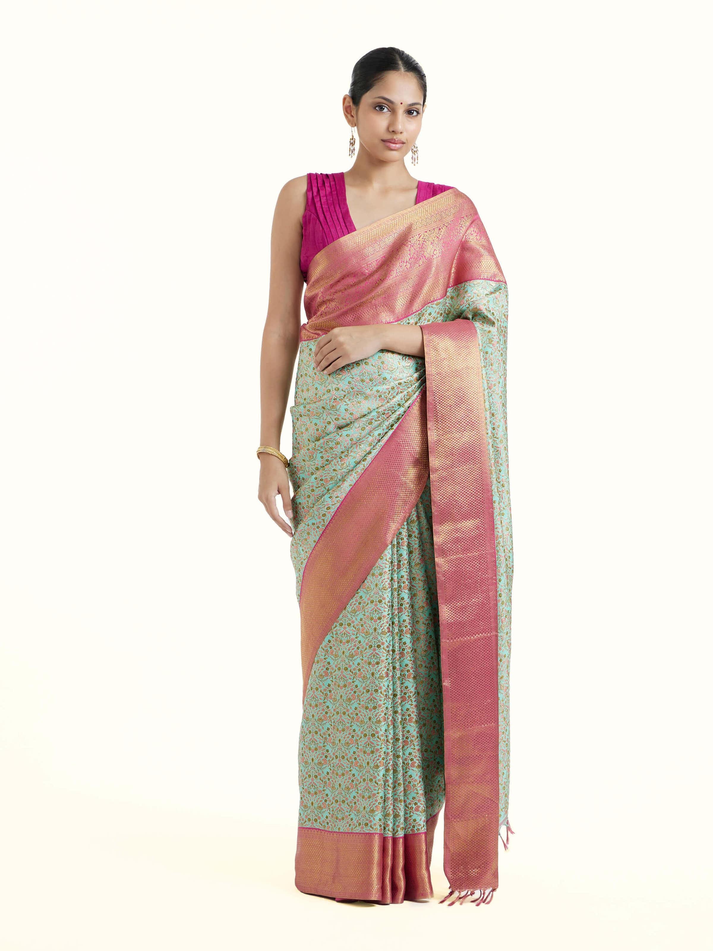 Front view of sea green silk Kancheepuram saree with rich zari woven motifs
