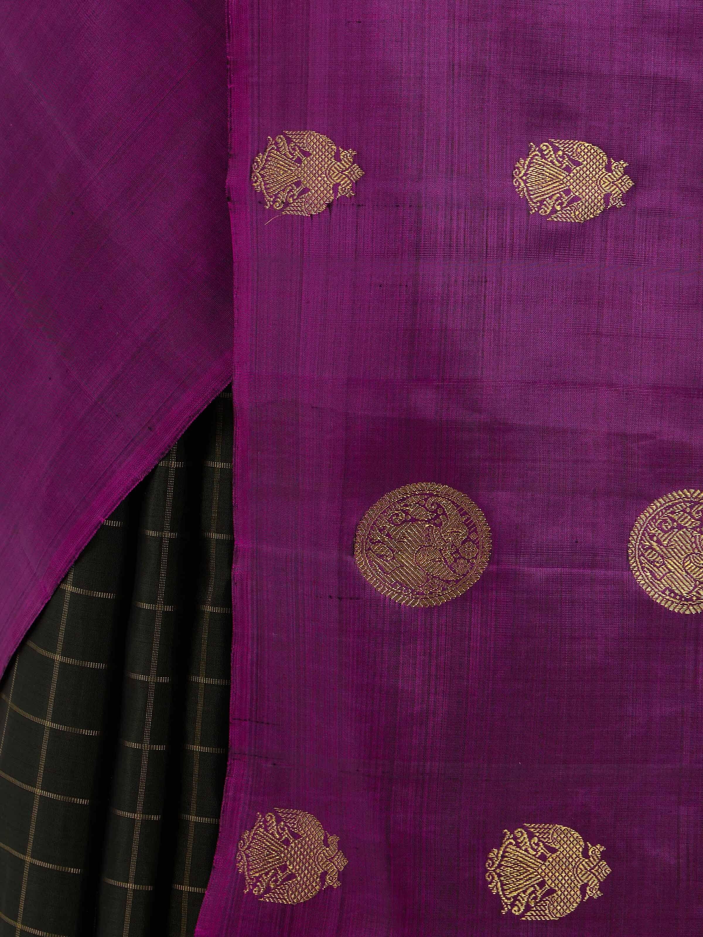 Detail view of black silk Kancheepuram saree showing zari craftsmanship