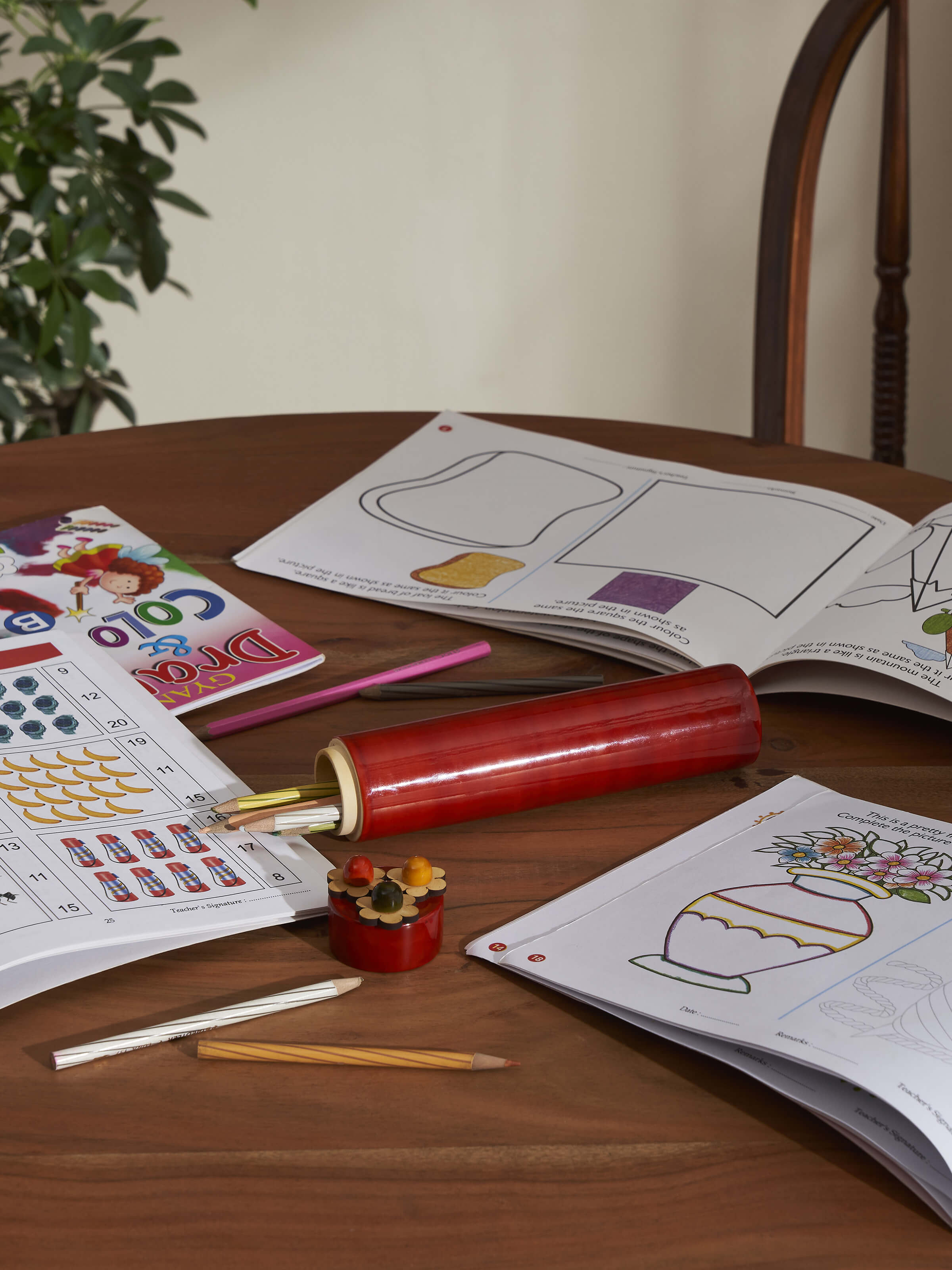 Lifestyle view of Channapatna Ivory Wood Sketch Kase Slim Red