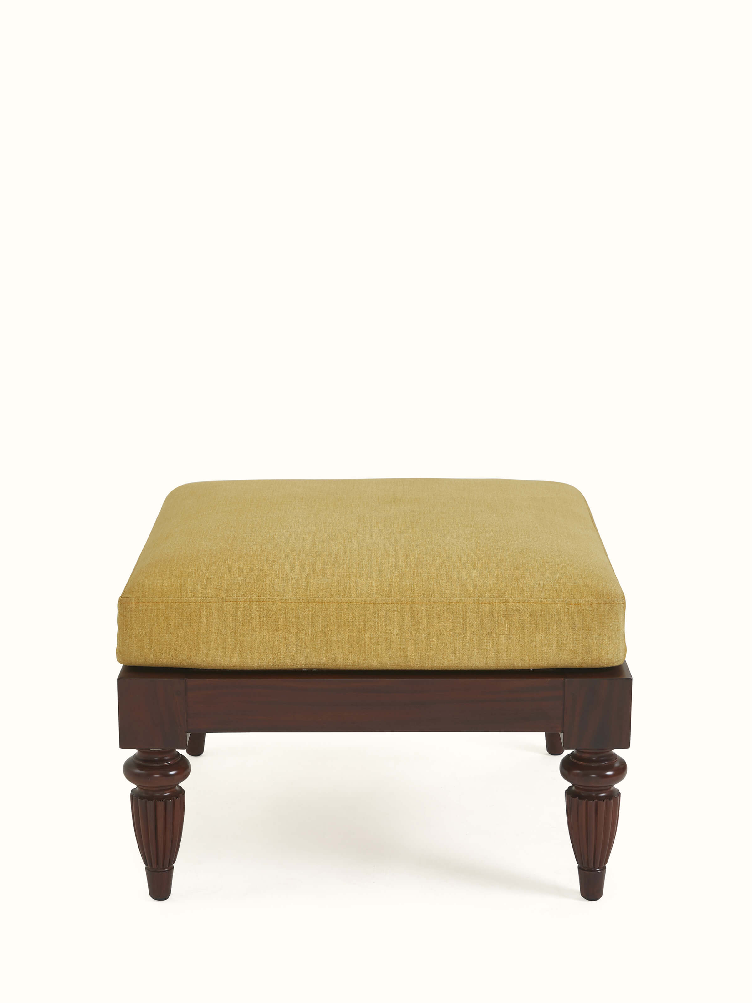 Front view of Upholstered Mahogany Wood Ottoman by Swadesh showcasing its plush cushioning and polished wooden base.