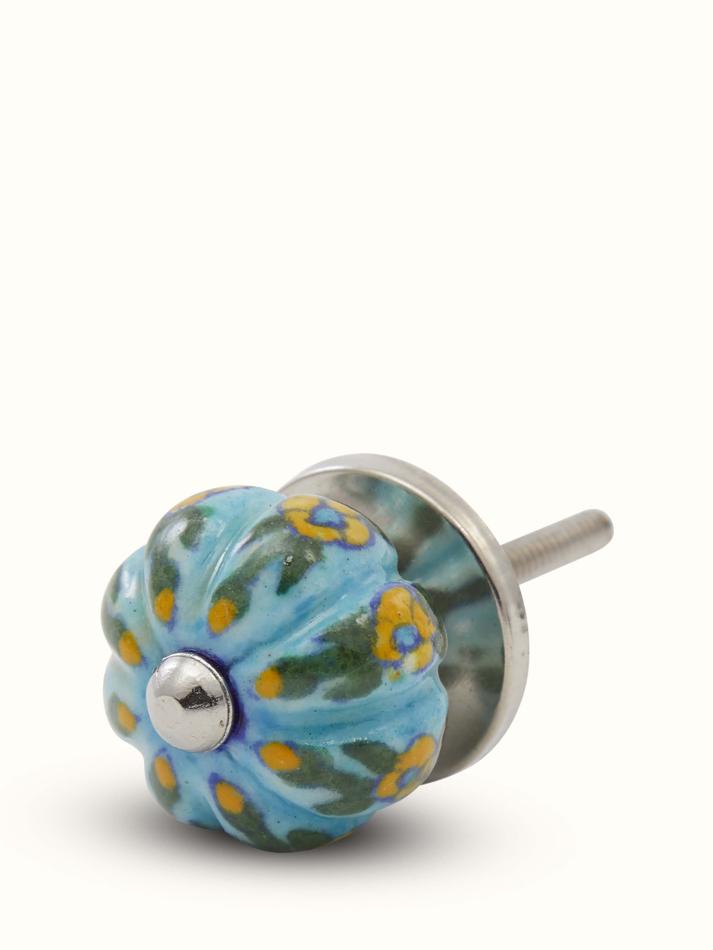 Angled view of blue pottery round rib door knob set for cabinets and drawers