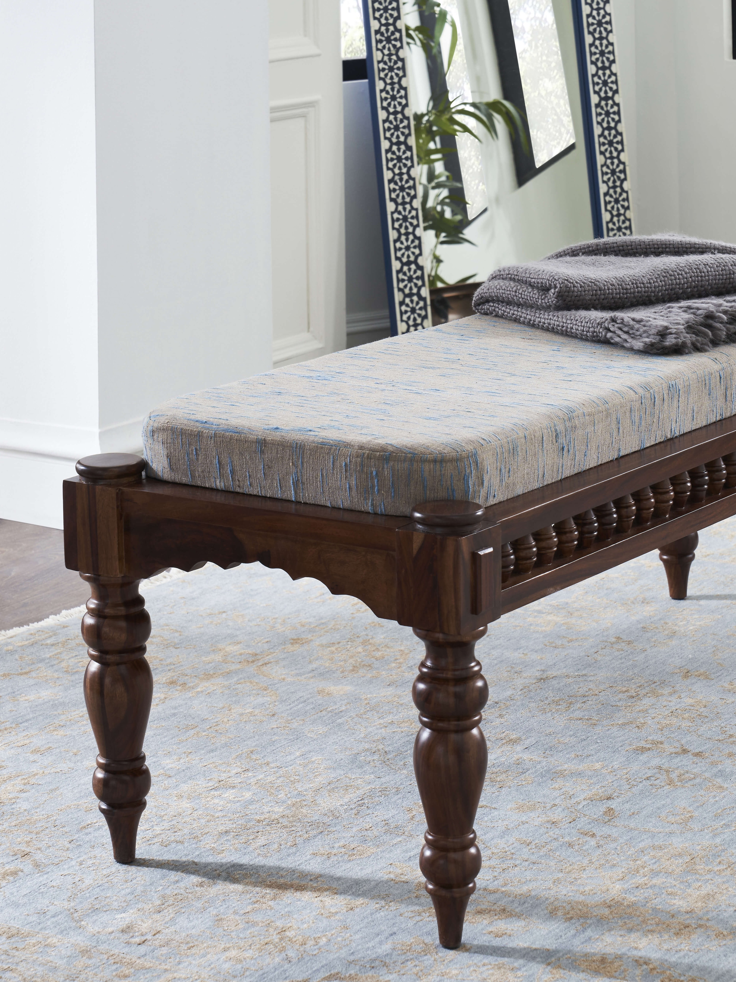 Side view of Upholstered Sheesham Wood 2-seater Bench featuring plush cushioning and intricate woodwork details.