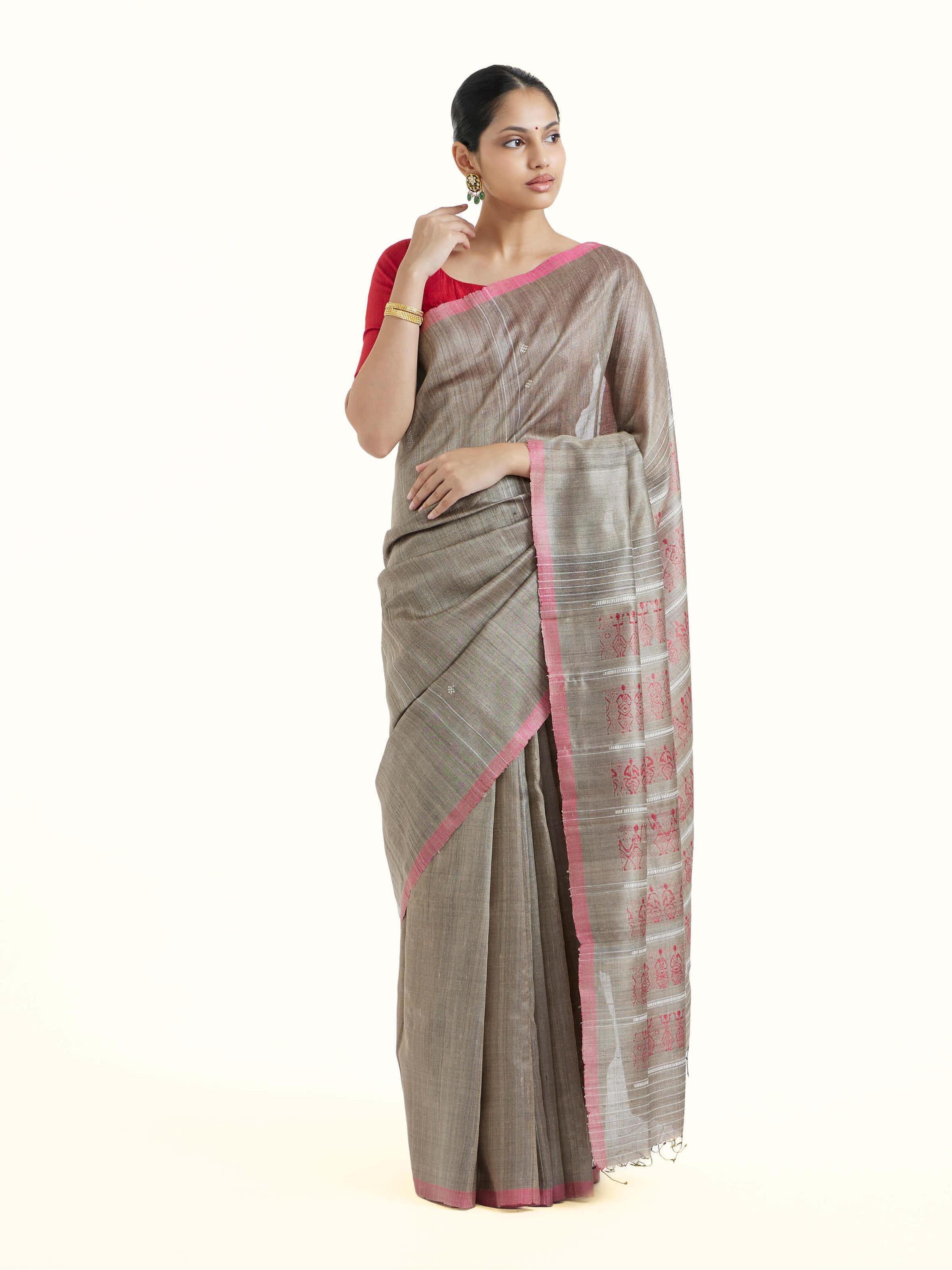 Front view of beige tussar silk Odisha ikat saree showcasing traditional ikat motifs