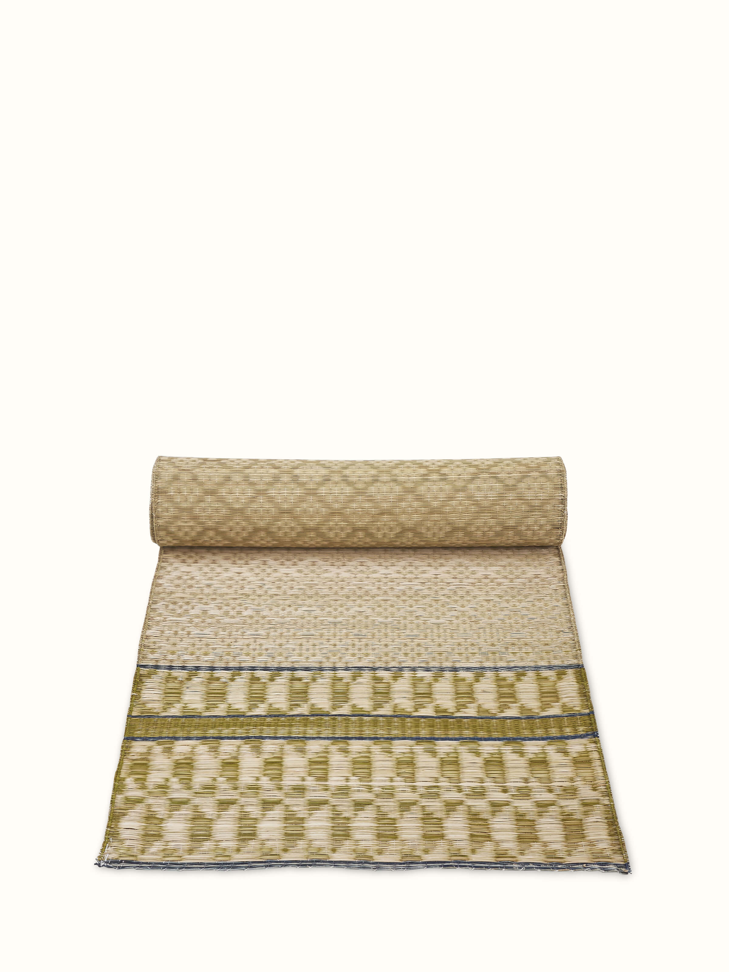 Angled view of Madurkathi green geo table runner
