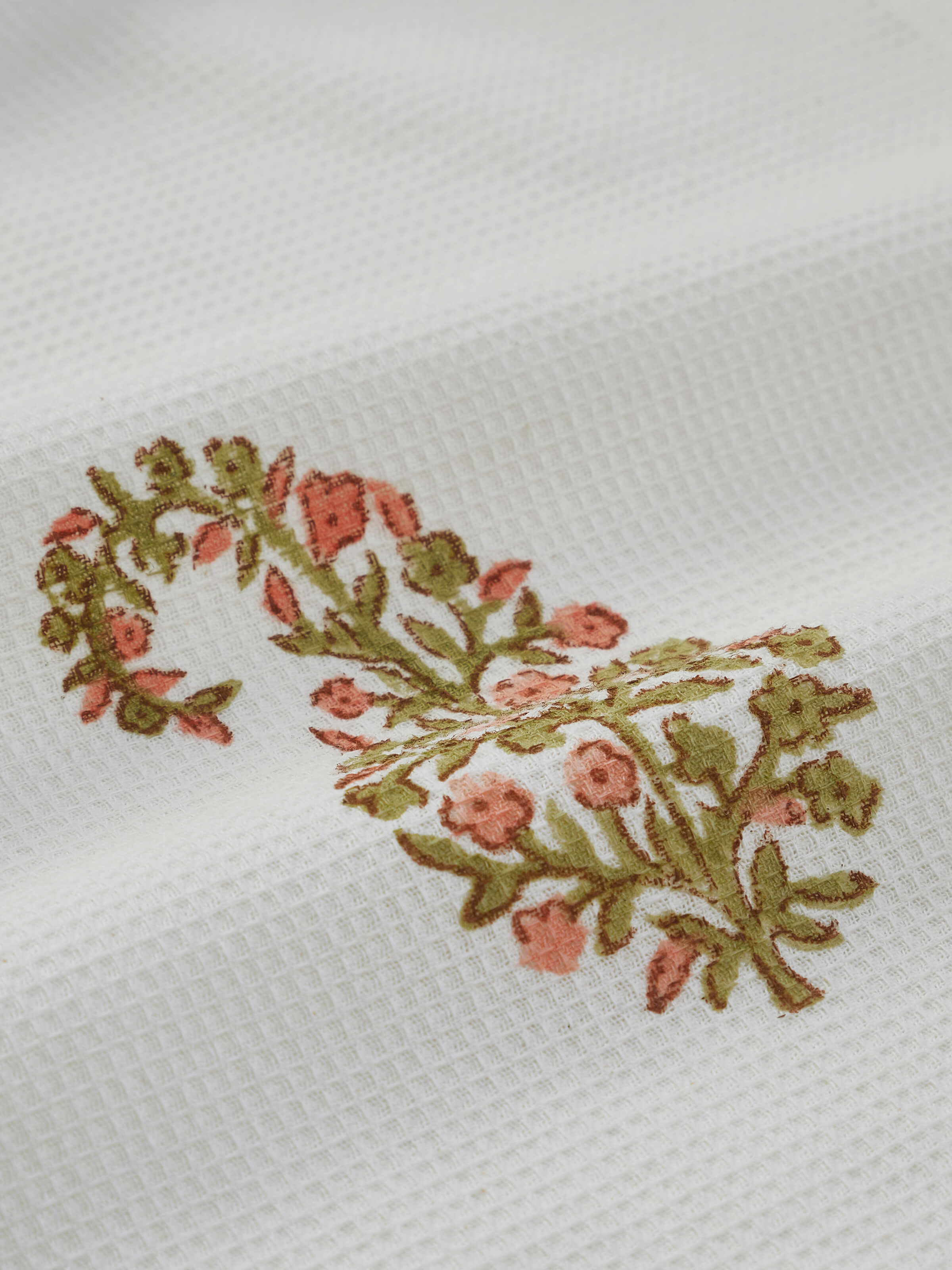 Angle view of Ambi buta peach floral cotton Sanganeri block printed face towels (4 pcs) highlighting softness and quality