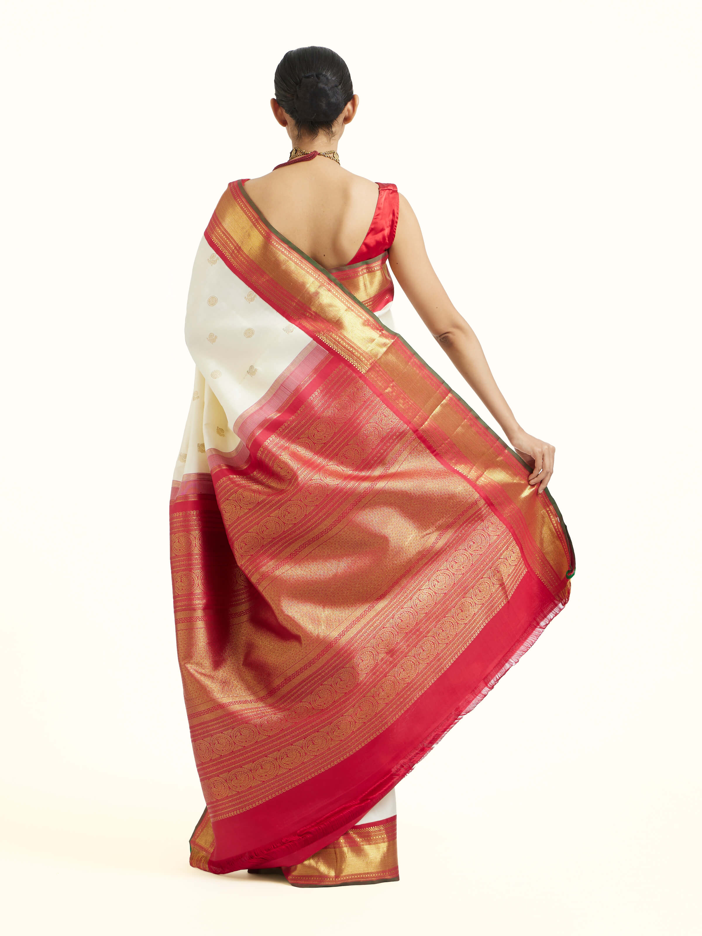 Back view of off-white silk Kancheepuram saree displaying ornate pallu design