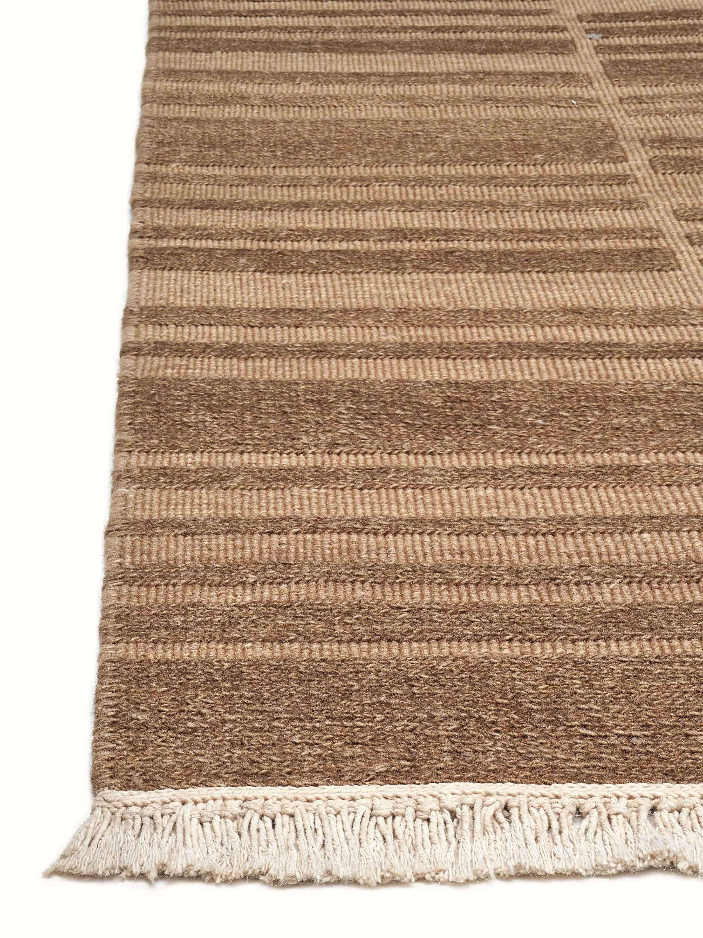 Side angle focusing on the rich texture and depth created by the multi-layered knotting technique