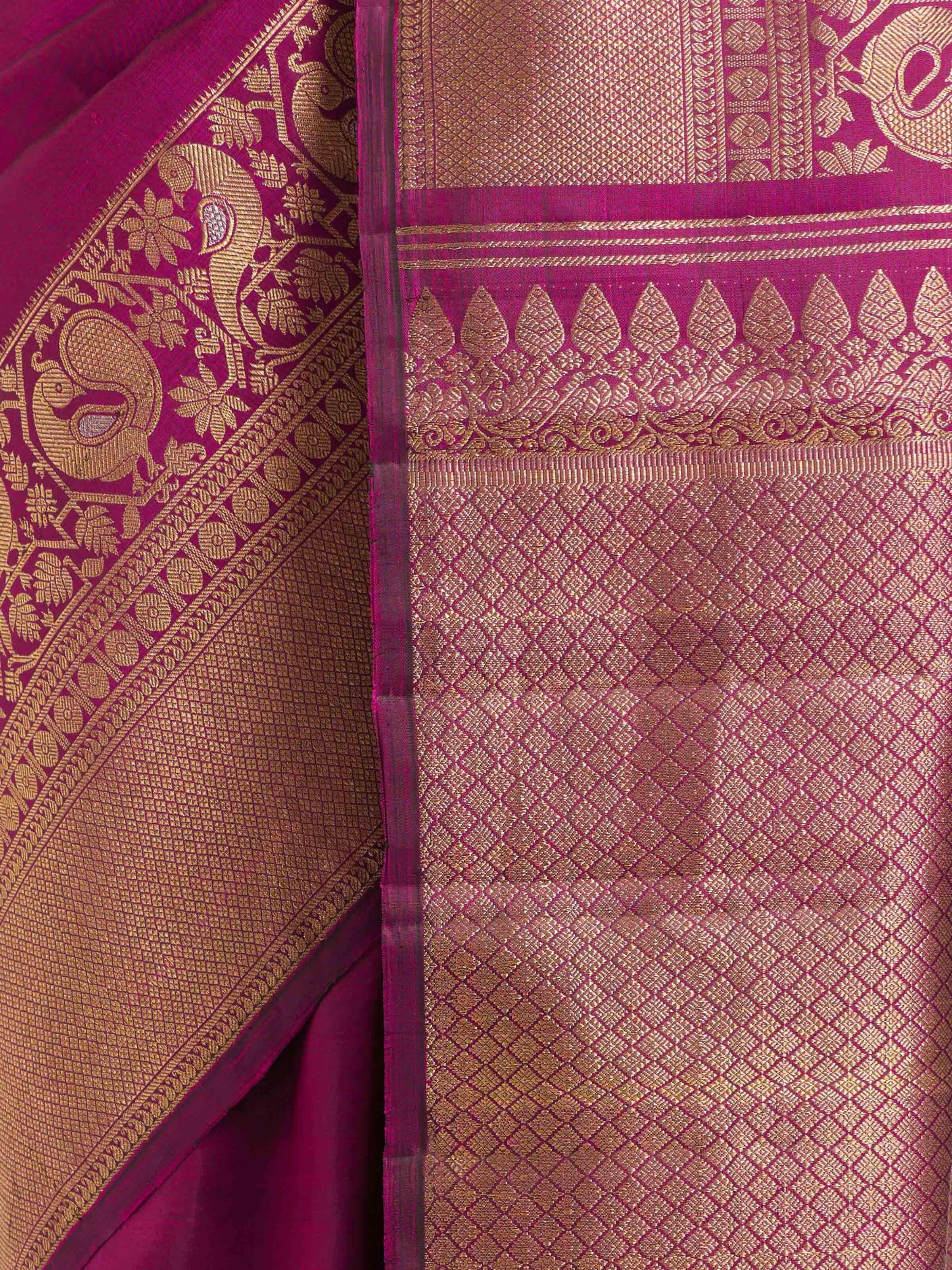 Detail view of purple silk Kancheepuram saree showing silk texture and zari work