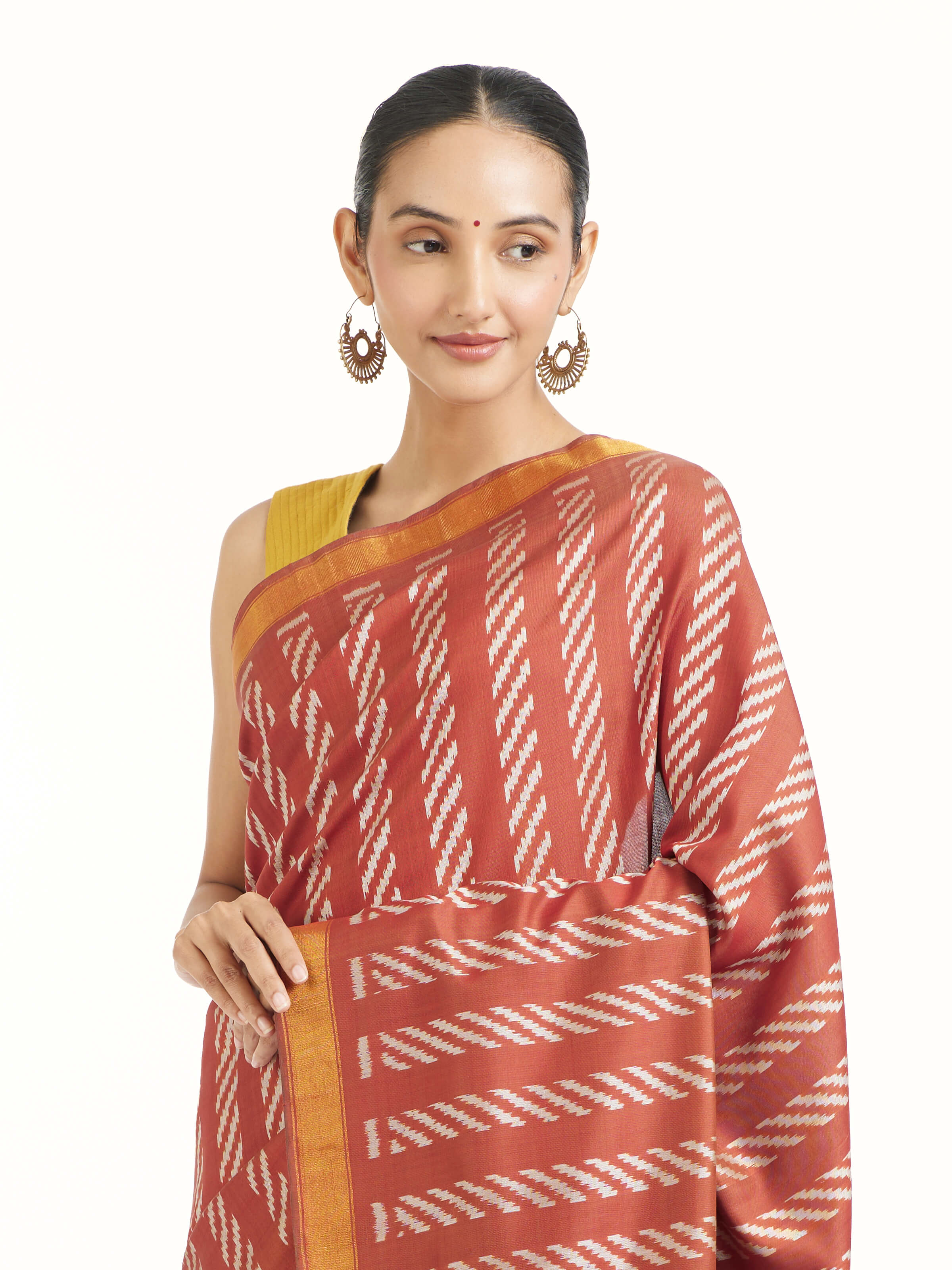 Angled view of pink mulberry silk Patola saree highlighting double ikat weave