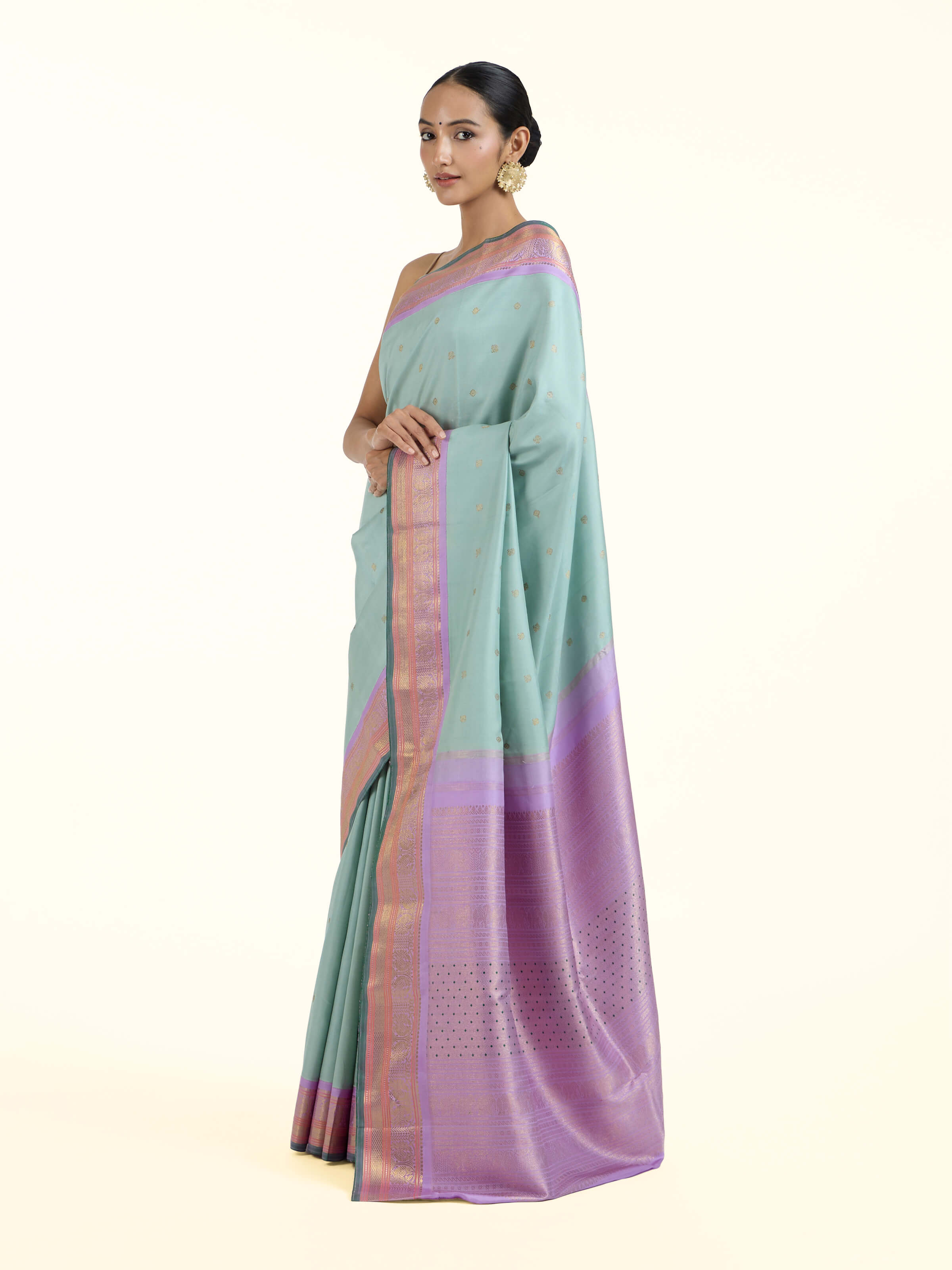 Side view of light blue silk Kancheepuram saree with graceful drape and contrast border