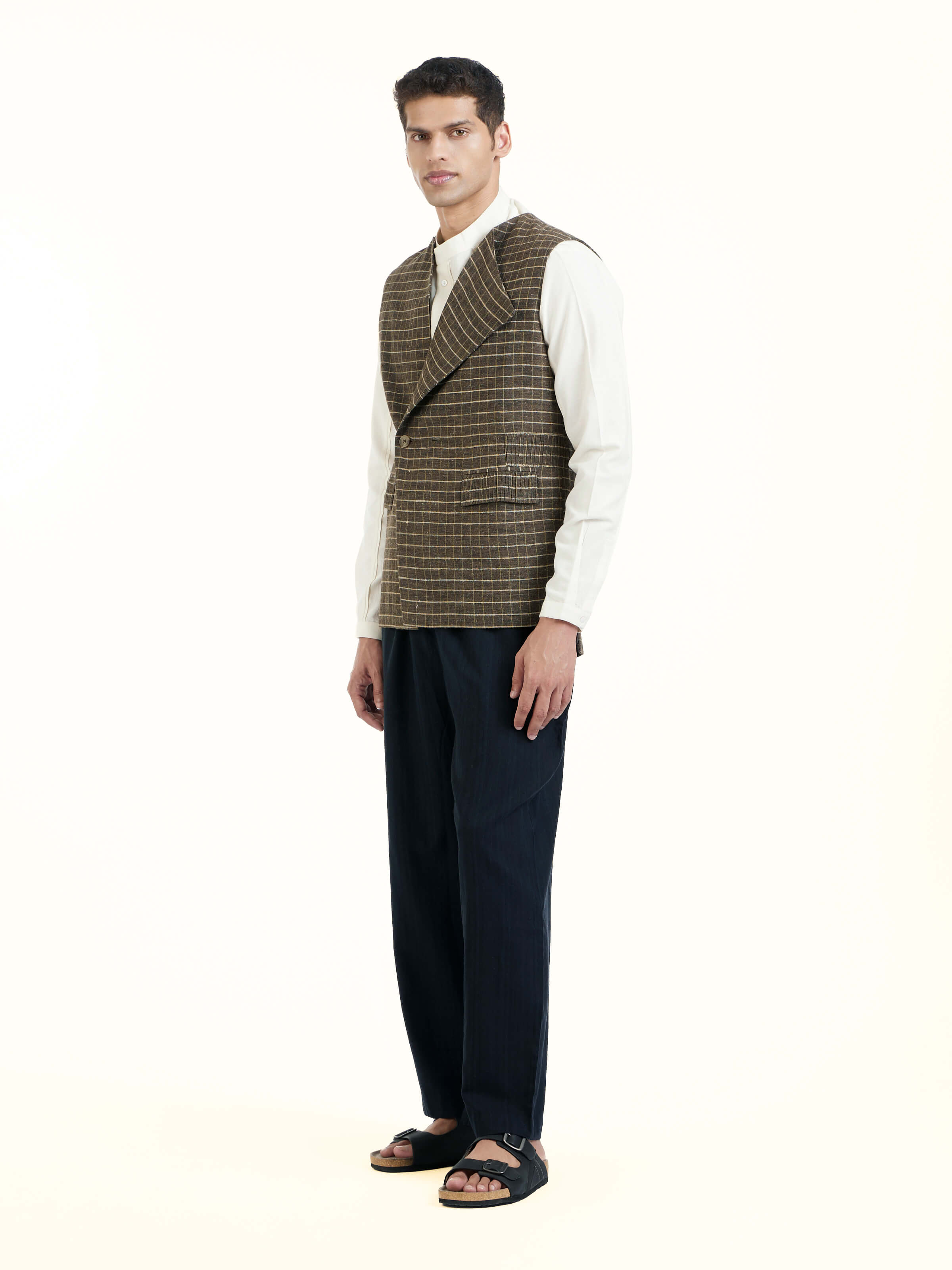 Side view of brown handloom sleeveless jacket showing tailored fit and silhouette