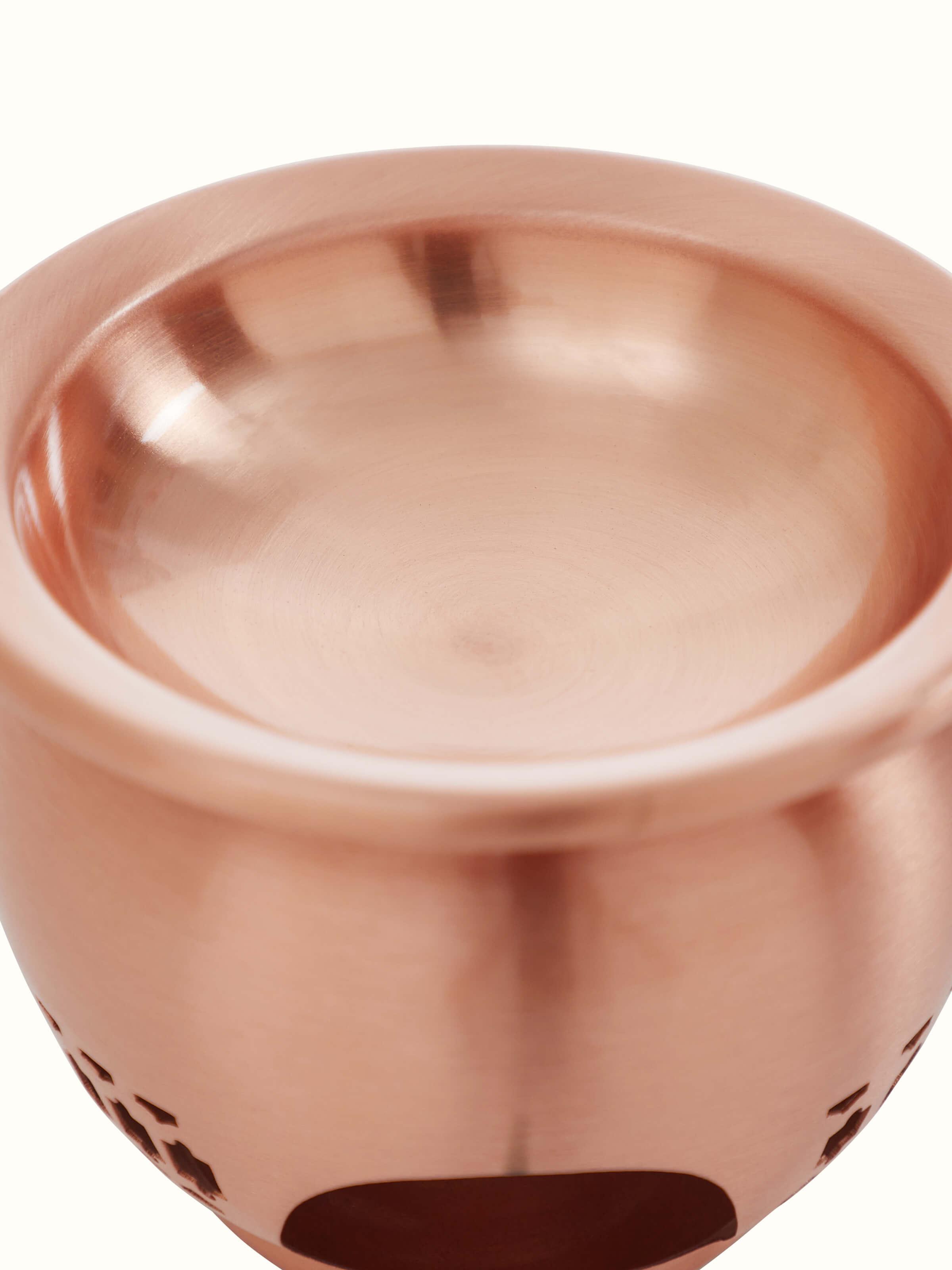 Back view of natural copper diffuser emphasizing its unique design and premium material