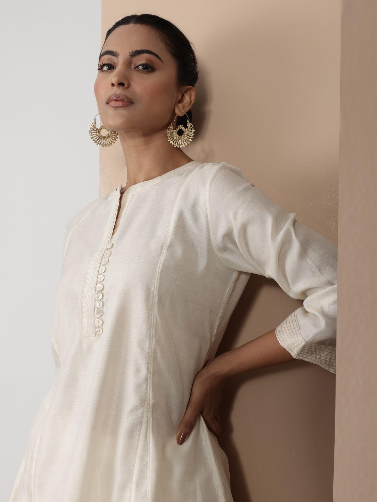 Alternate lifestyle view of off-white kurta emphasizing the Chanderi weave and minimalist styling.