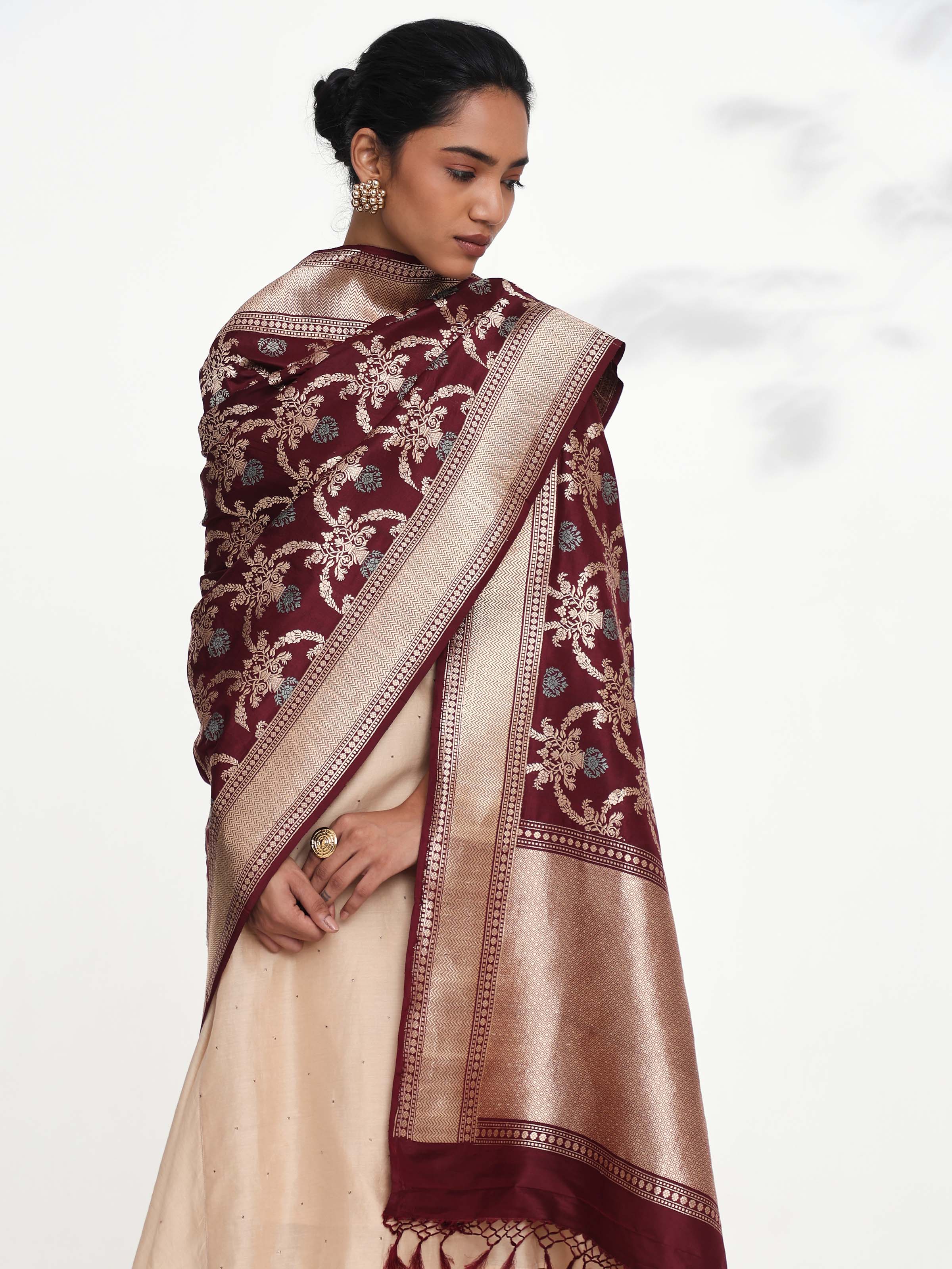 Angled view of wine Banarasi silk kadwa jangla handwoven dupatta highlighting jangla patterns