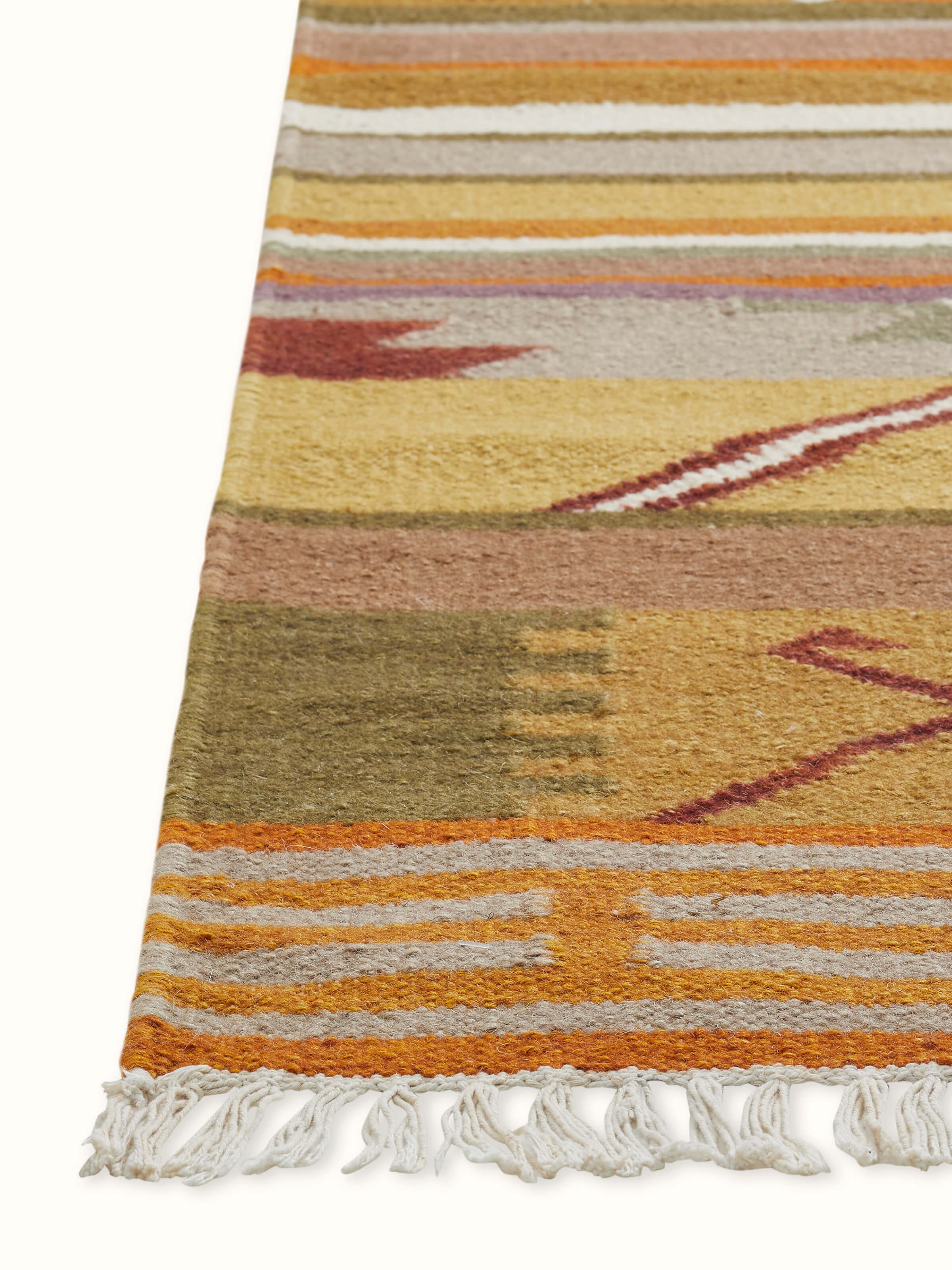 Angled shot revealing multitone patchwork and textured Panja weave.