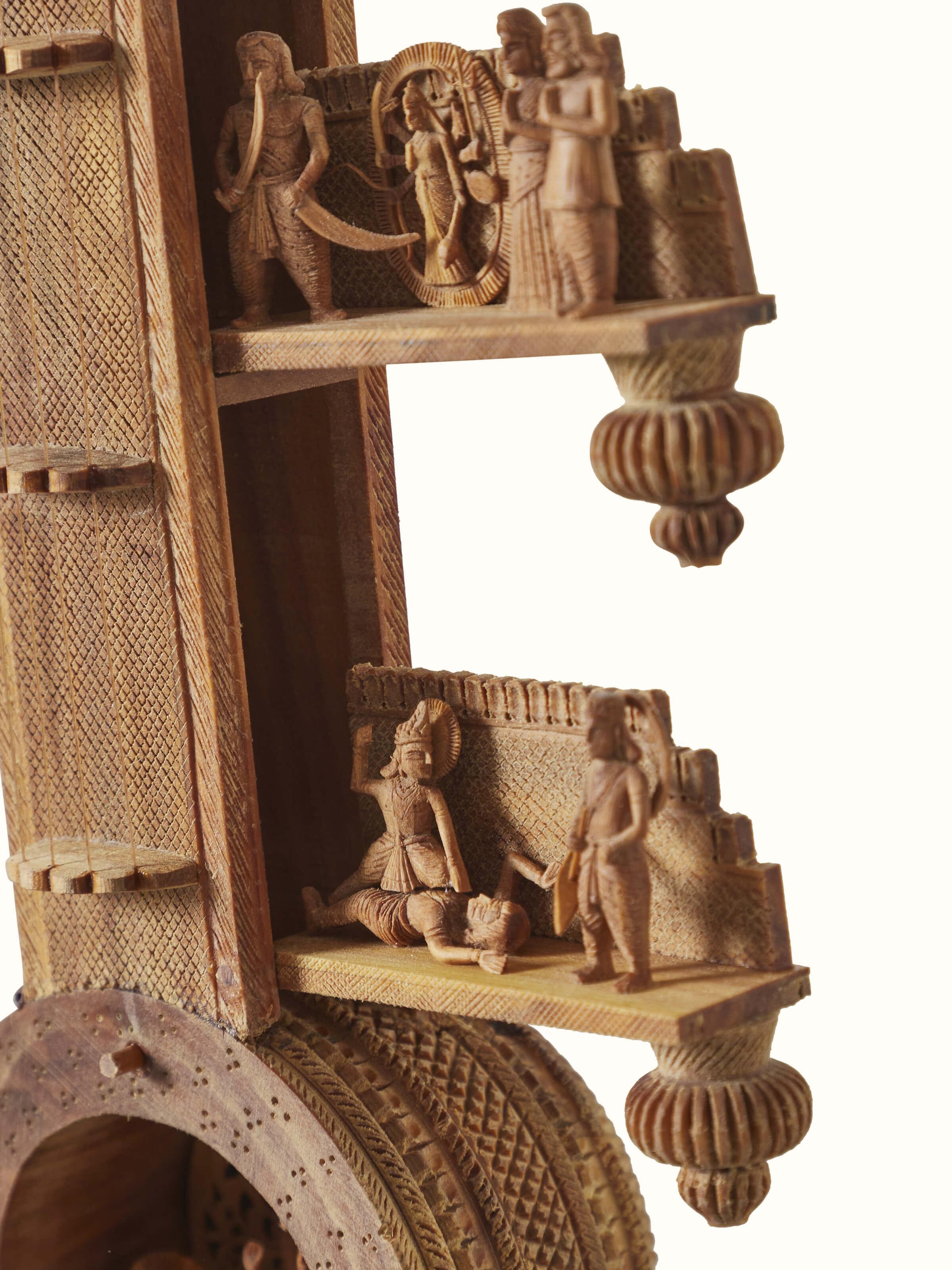 Full view of carved sandalwood devotion veena sculpture, highlighting its elegant design and intricate carvings.