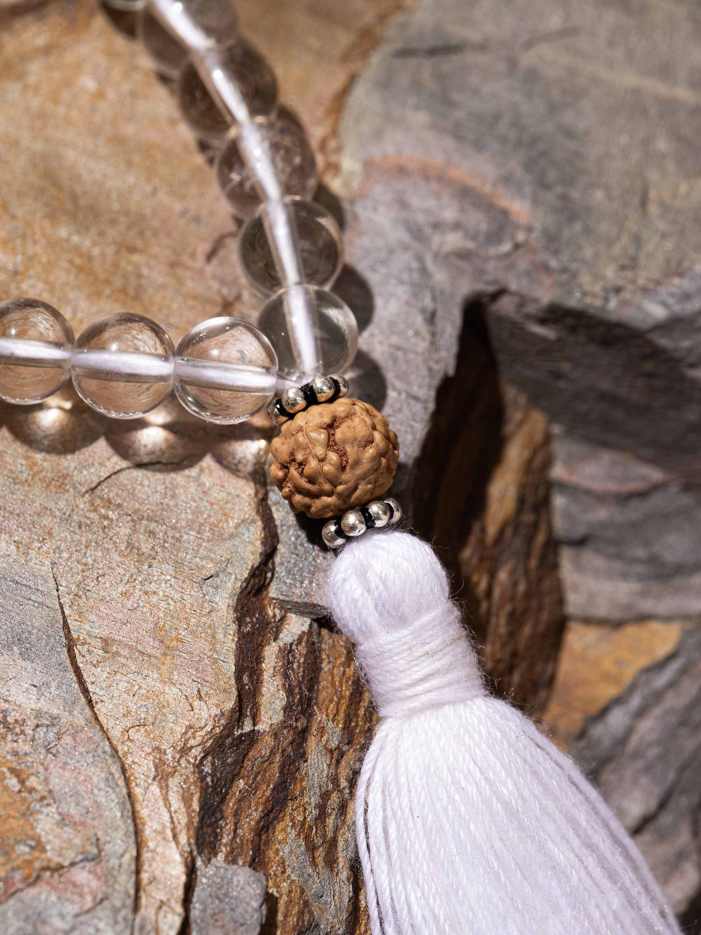 Detailed shot of Rudraksha & Sphatik Silver Mala, focusing on bead clarity and silver accents