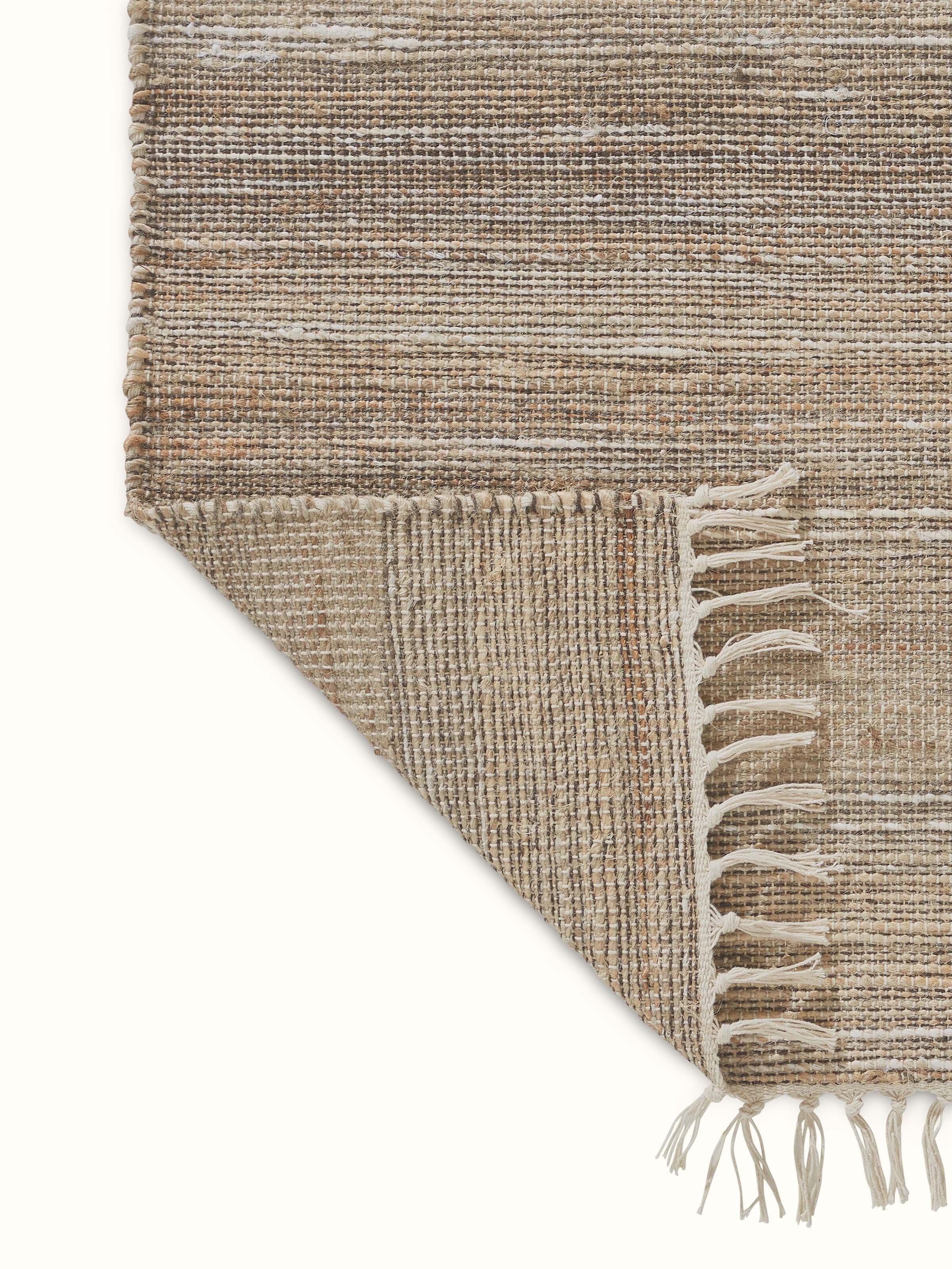 Angled view of Textured Beige Lawan Jute & Cotton Natural Fibre Runner emphasizing its textured finish.