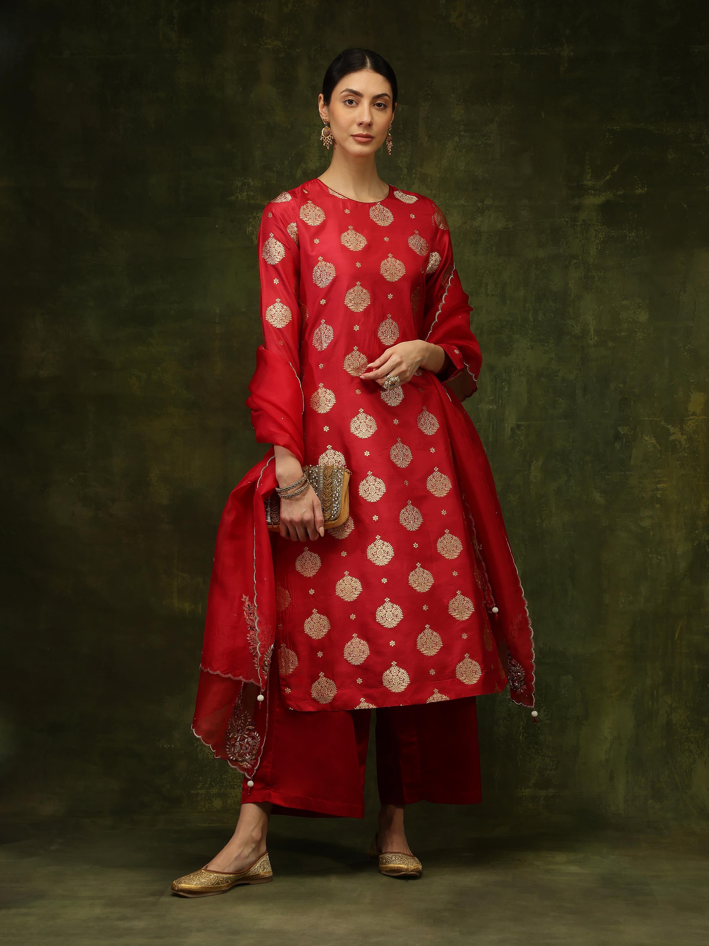 Lifestyle view of maroon silk Banarasi kurta worn with traditional accessories