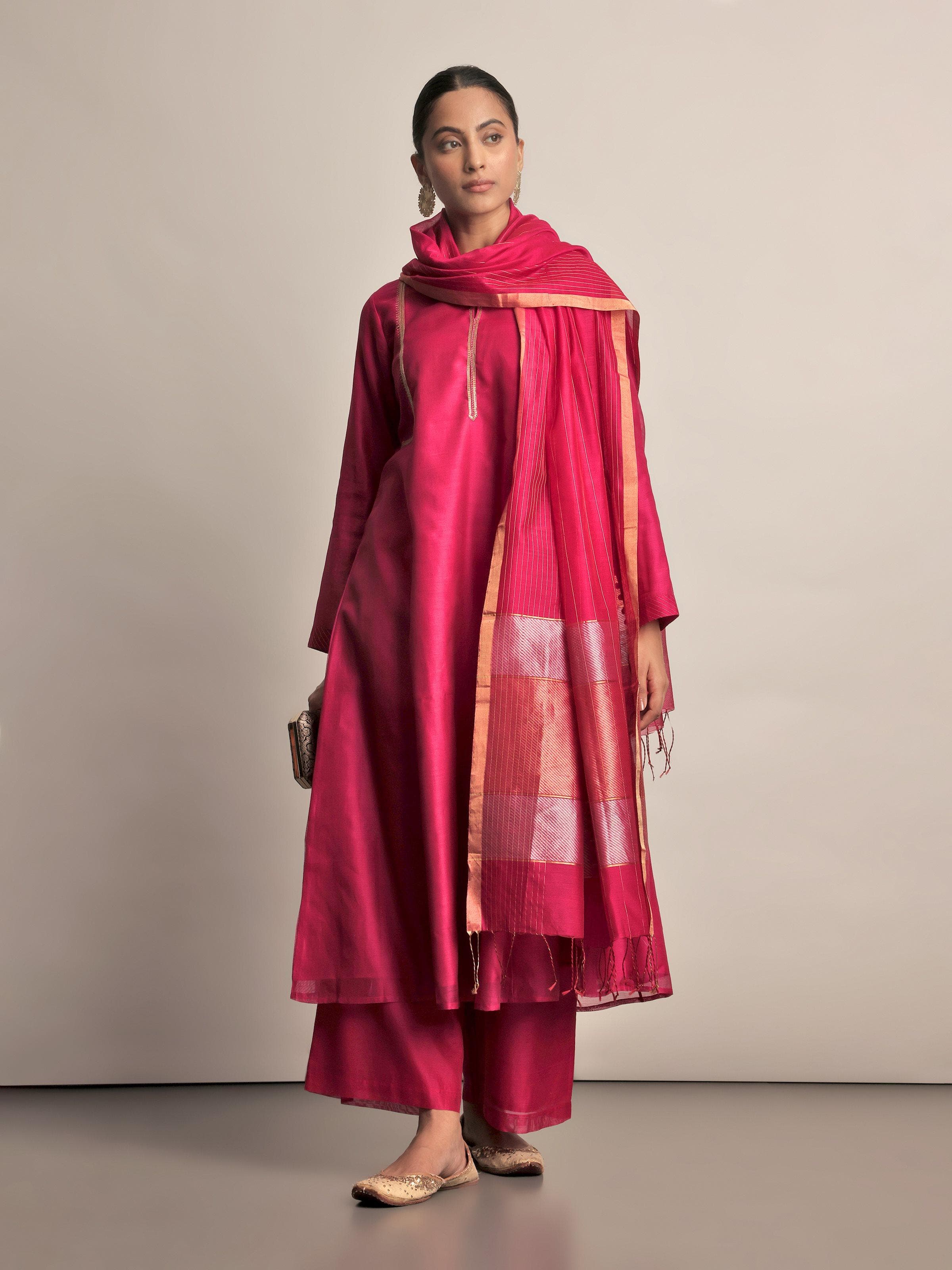 Angled view of fuschia Chanderi palazzo showing pleated design and lightweight fabric