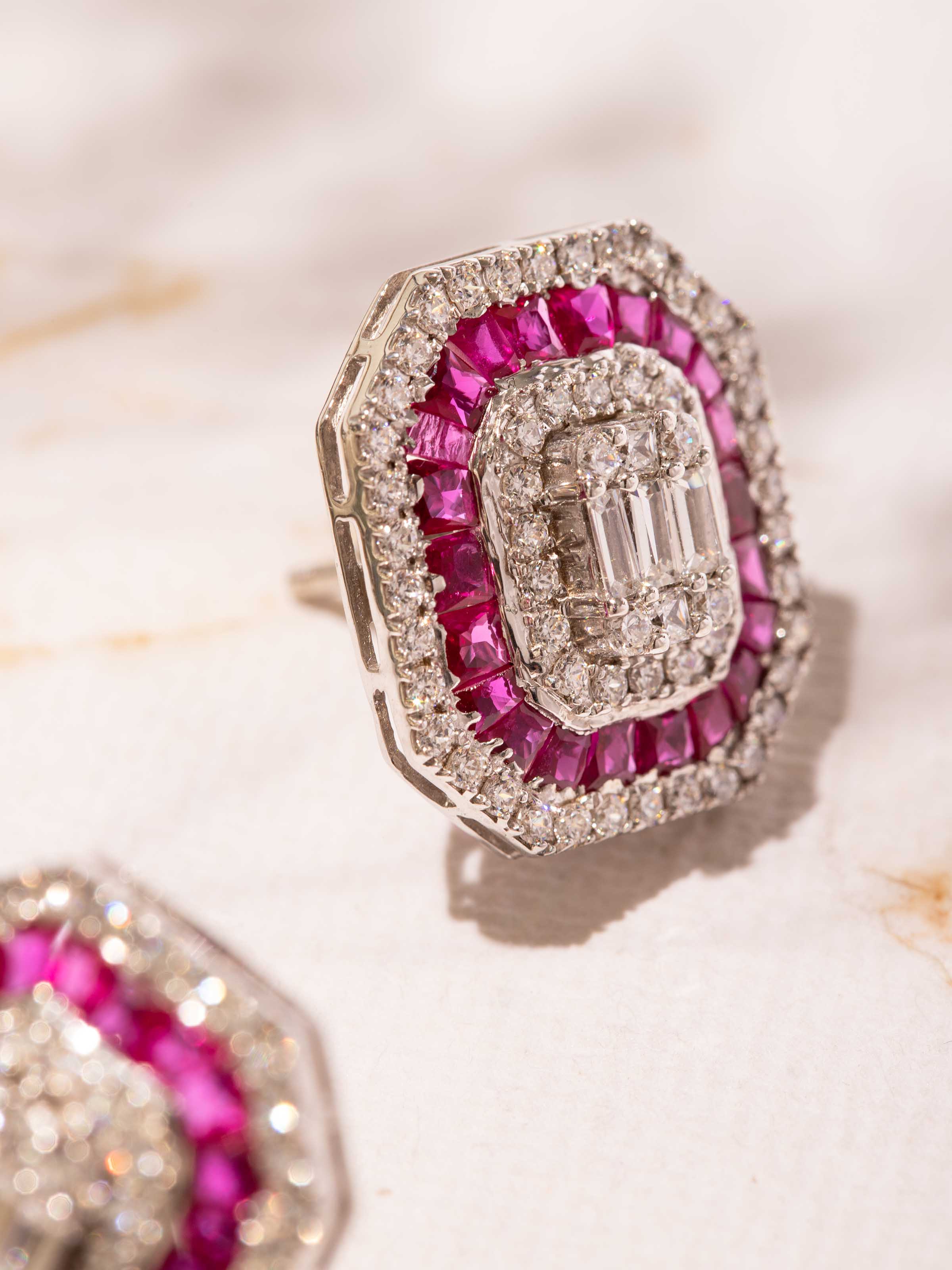 Detail shot highlighting textured carving of Silver Smithing stud earrings.