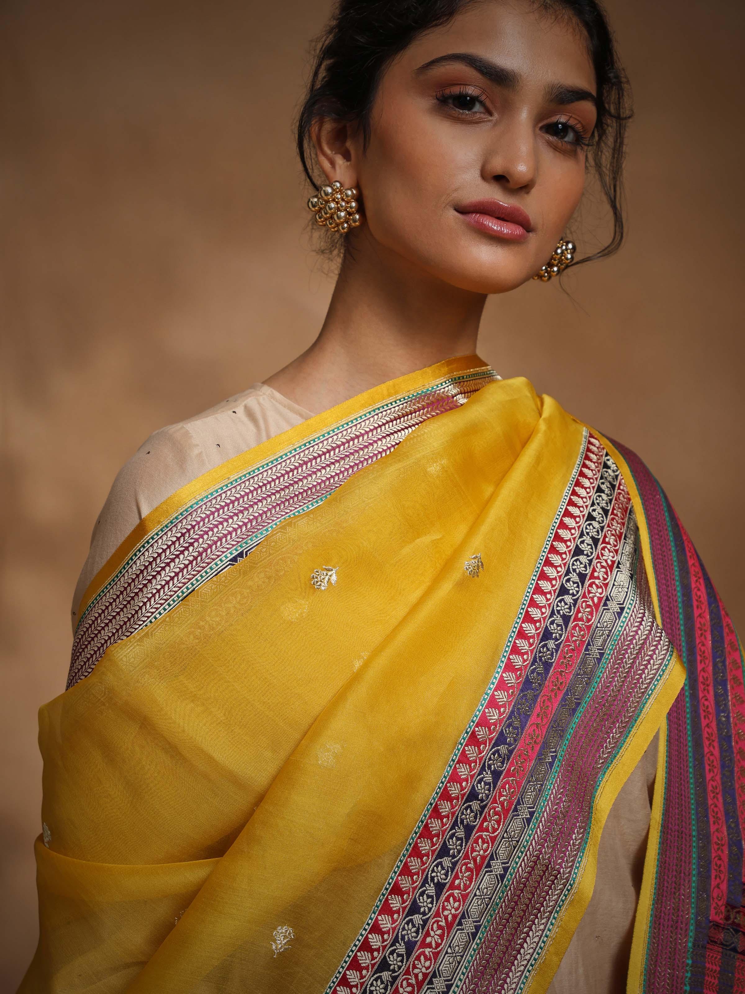 Back view highlighting the fabric flow of yellow Banarasi silk dupatta