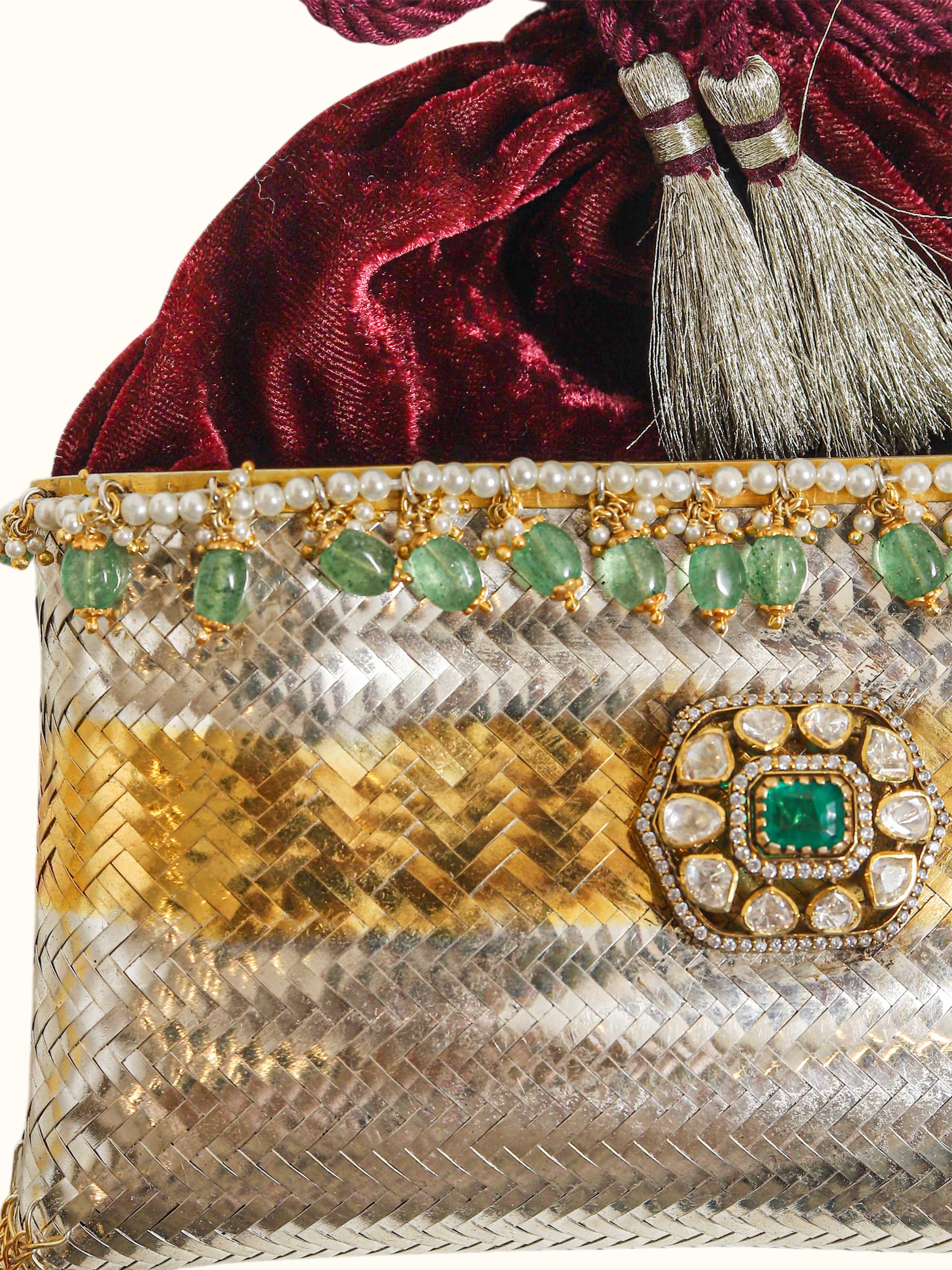 close-up view of silver smithing two-tone potli-style bag design