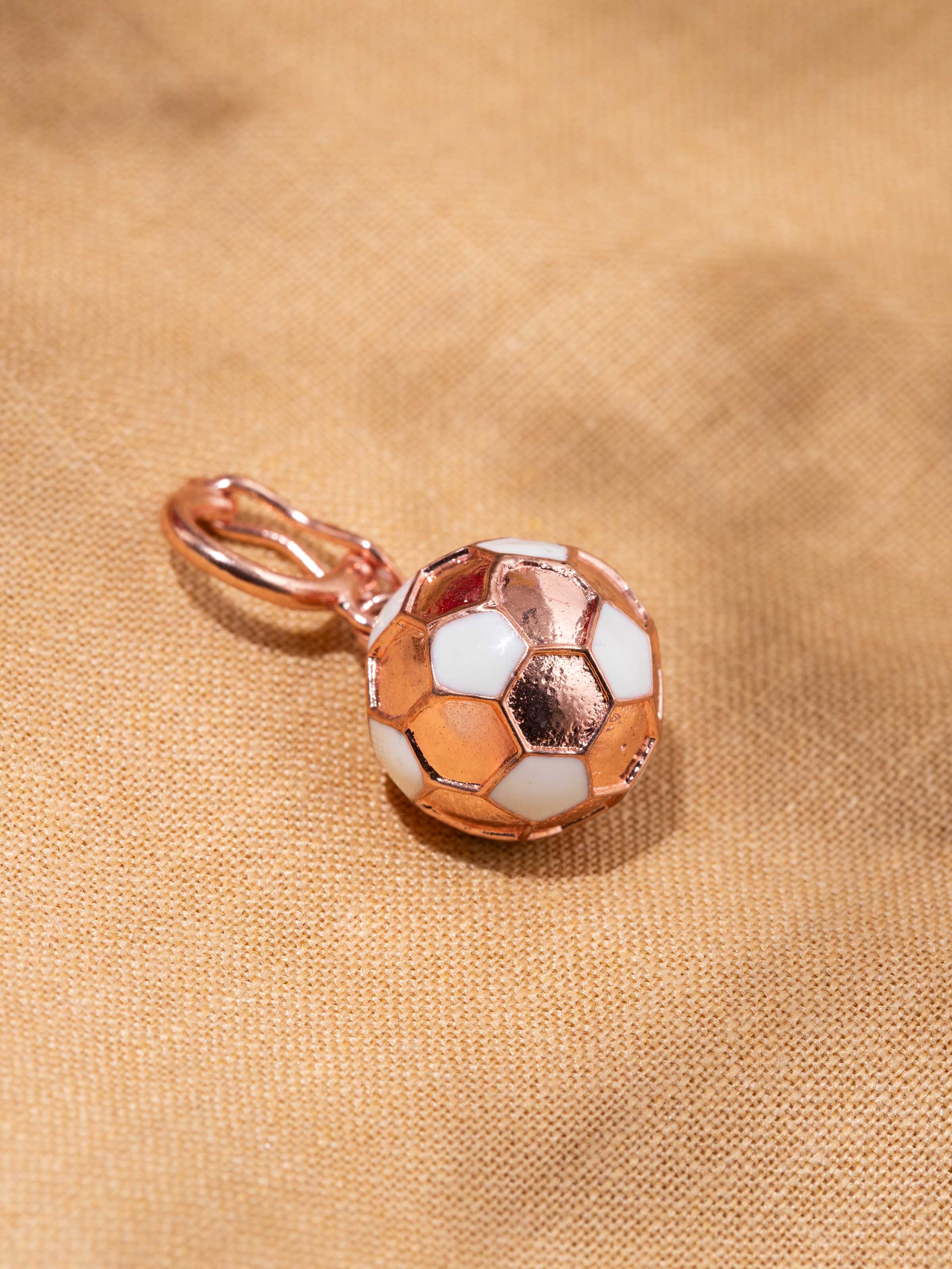 Detail shot of silver pendant revealing delicate handwork and textured finish