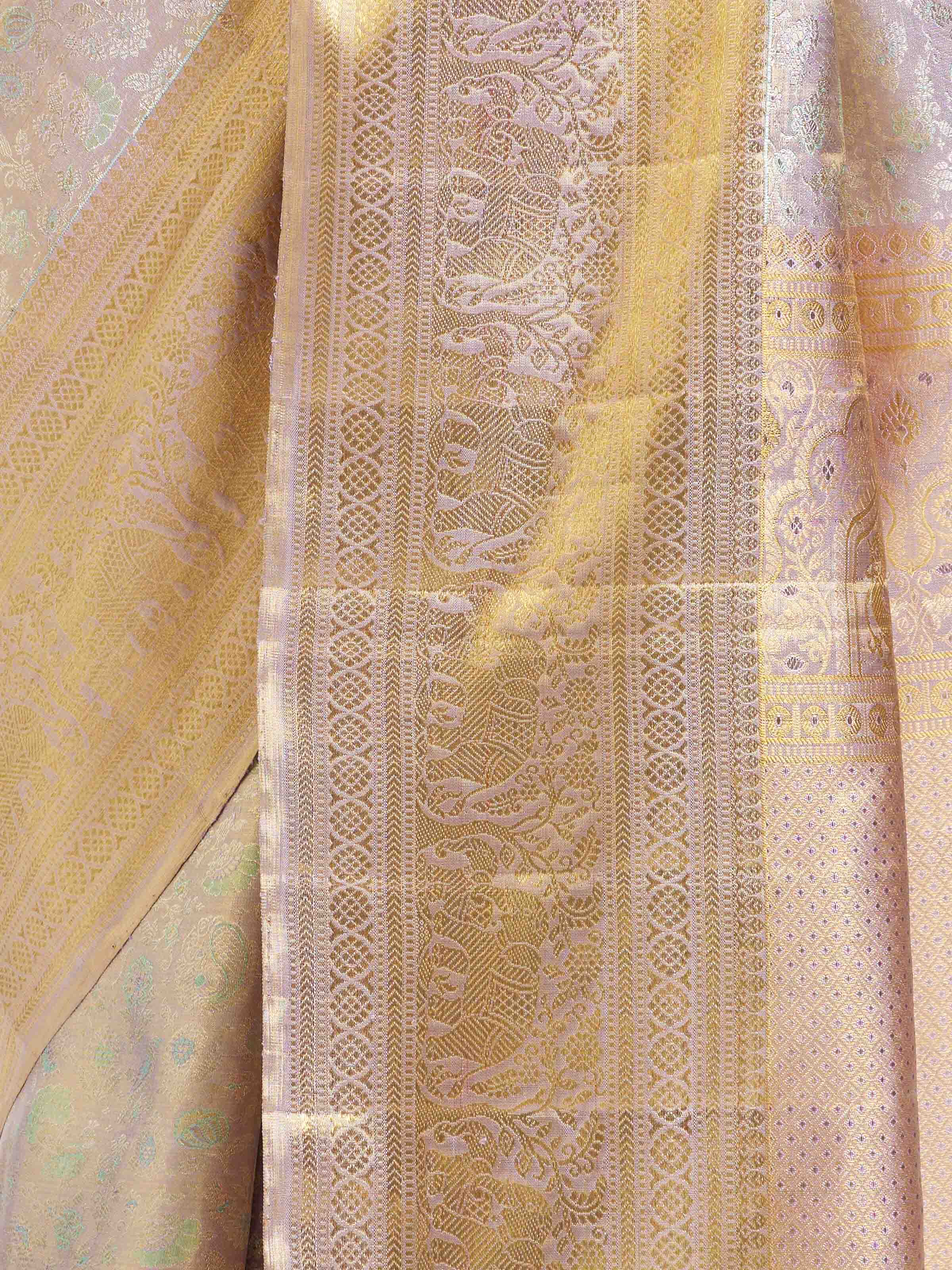 Detail view of silver silk Kancheepuram saree showing silk texture and zari work