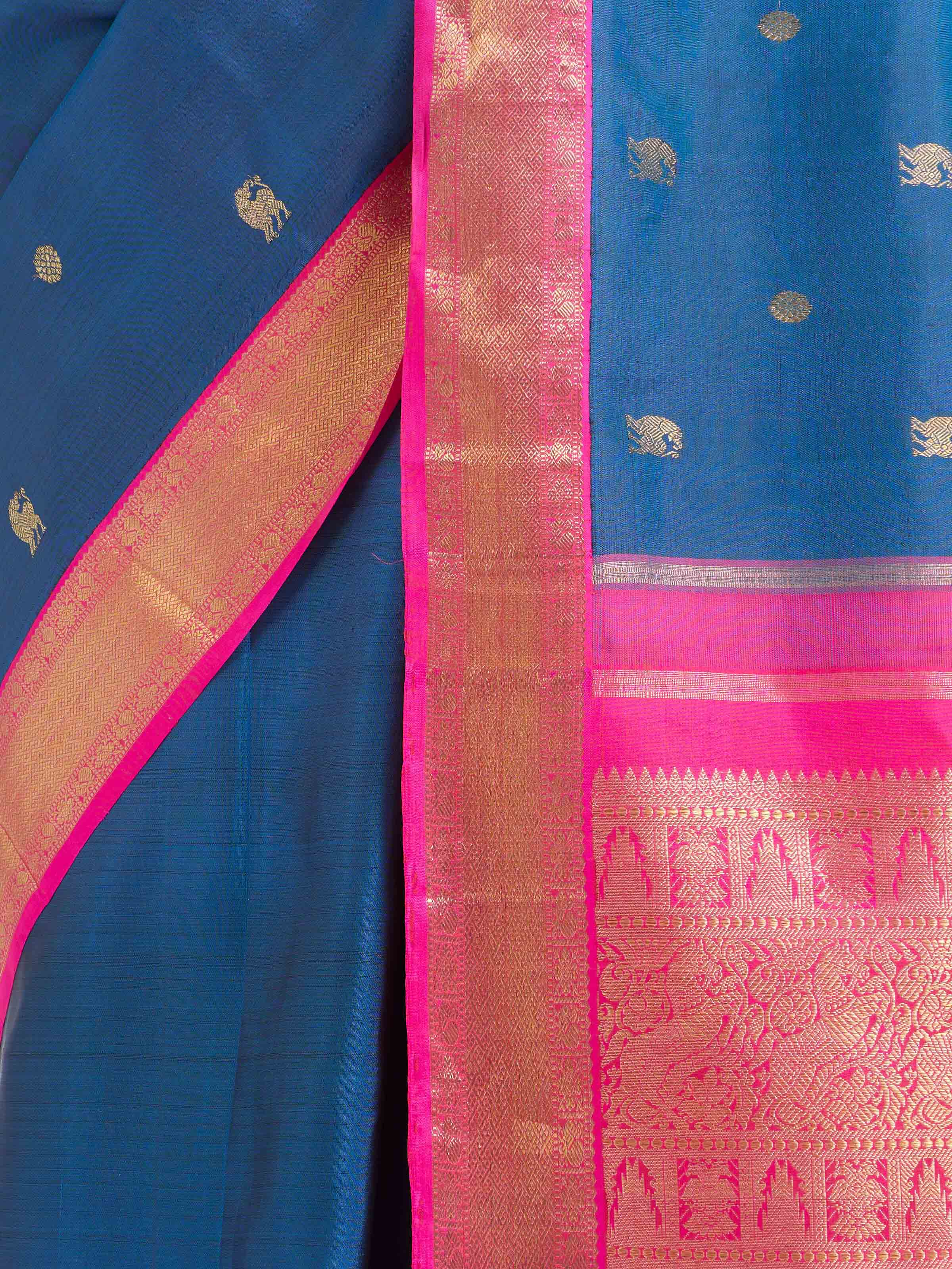 Detail view of dark blue silk Kancheepuram saree showing silk texture and zari craftsmanship