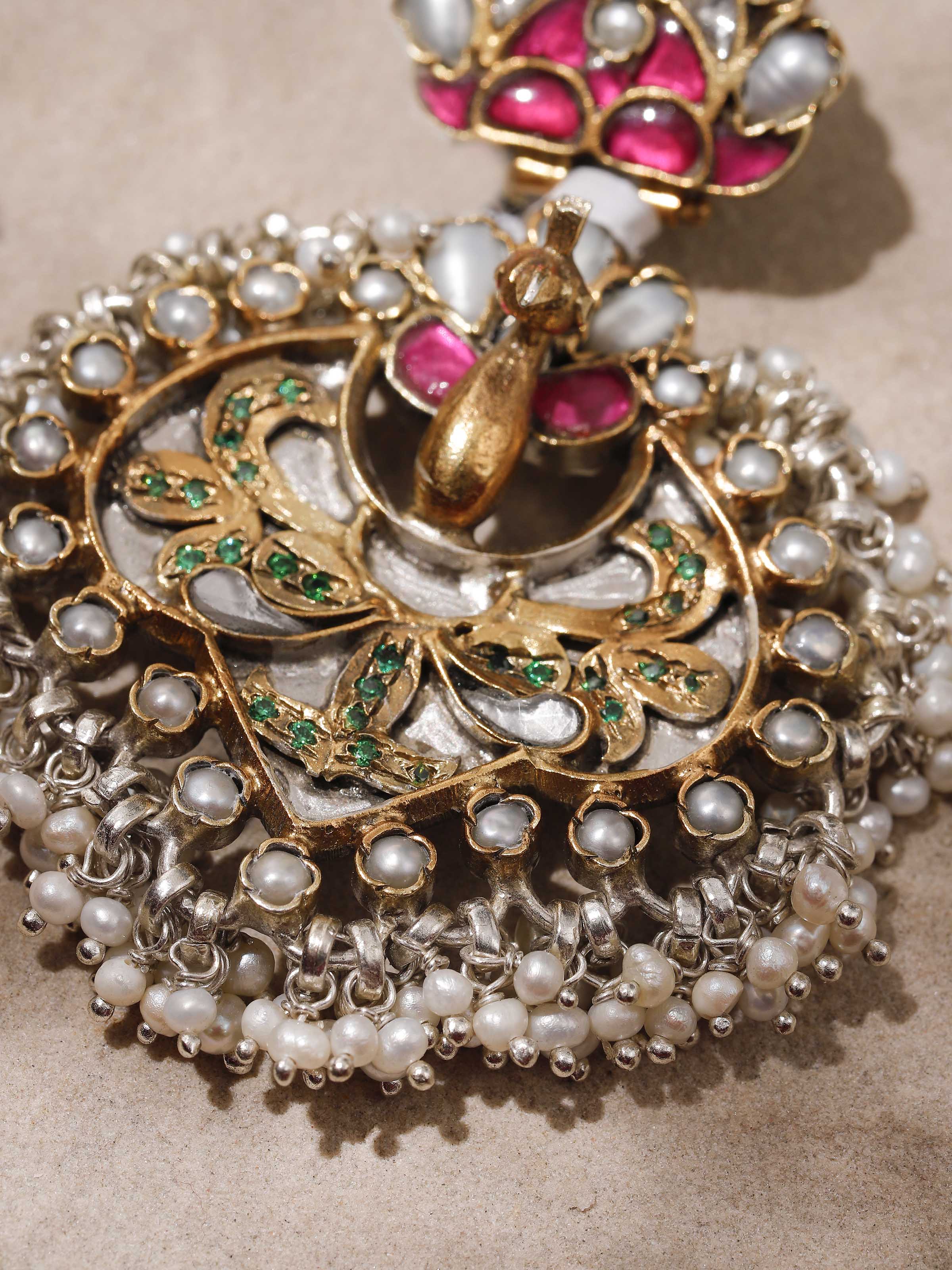 Side angle capturing the earrings’ profile and dimension